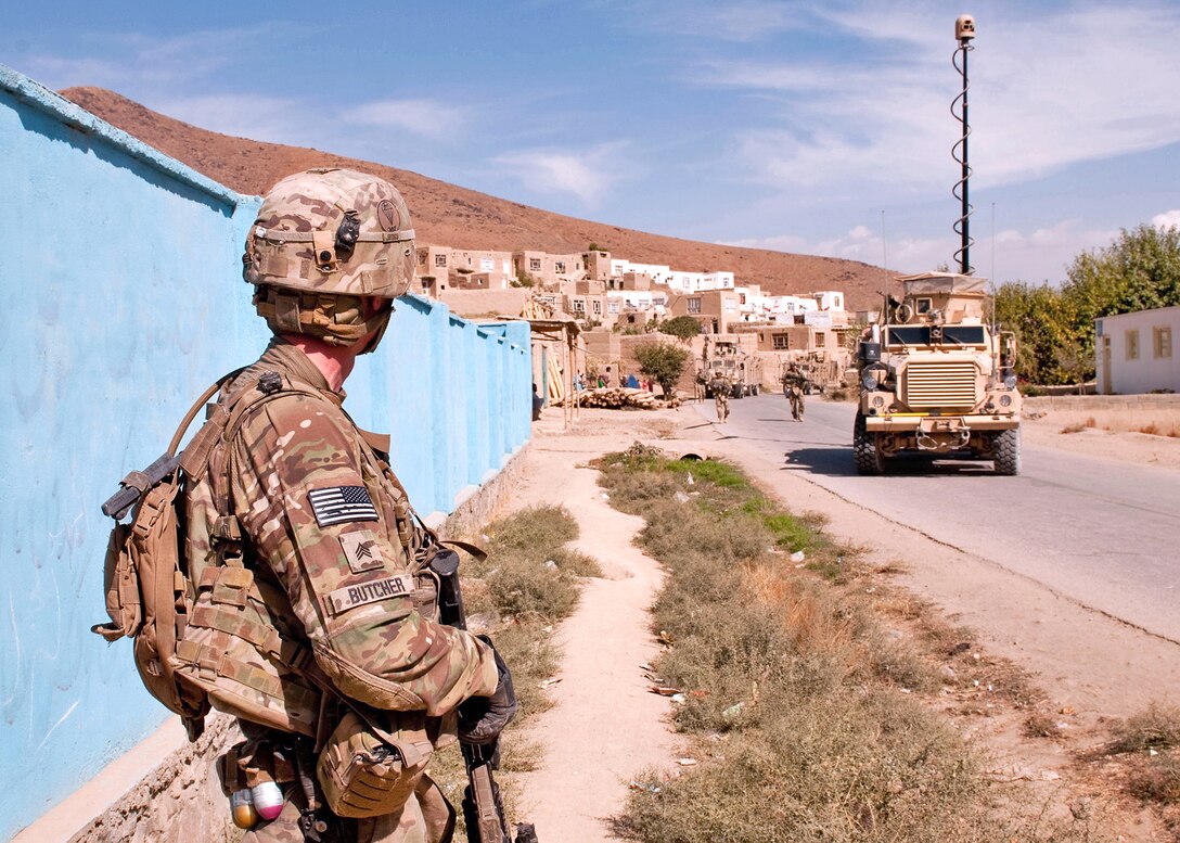 U.S. Army Sgt. Jonathan Butcher waits for the rest of his team to catch up during a dismounted patrol on the way to Combat Outpost Baraki Barak in Afghanistan's Logar province, Oct. 10, 2012. Butcher, a team leader, is assigned to the 102nd Sapper Company, 307th Engineer Battalion, Combat Airborne, 20th Engineer Brigade.