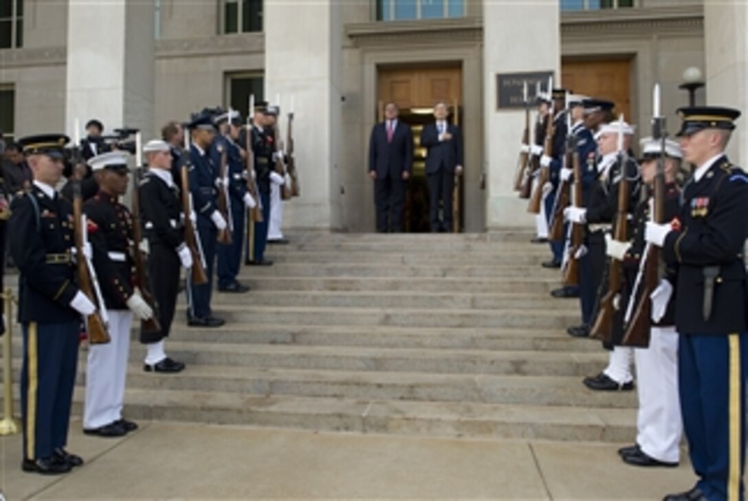 Secretary of Defense Leon E. Panetta, left, and South Korea's Minister of National Defense Kim Kwan-jin stand for the Republic of Korea anthem during an arrival ceremony for Kim at the Pentagon on Oct. 24, 2012.  Panetta and Kim, along with their senior advisors and foreign affairs officials, will meet for the 44th U.S.-Republic of Korea Security Consultative Meeting.  
