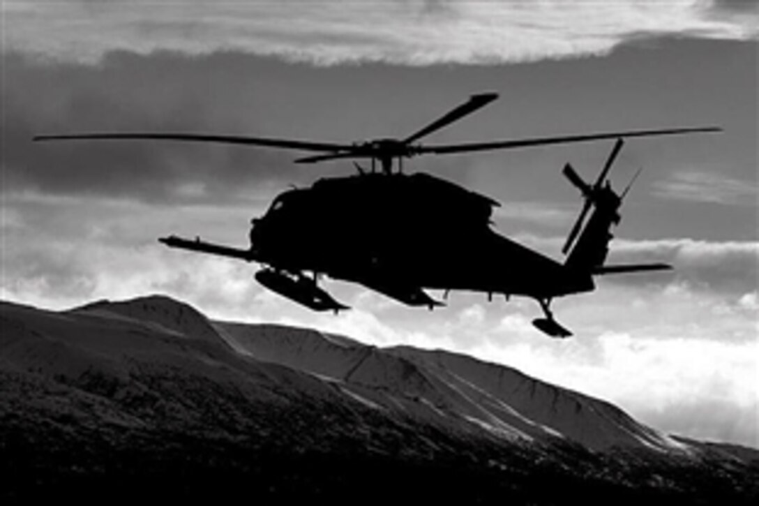 An Alaska Air National Guard HH-60 Pave Hawk helicopter flies over Alaska during a training mission in Alaska, Oct. 19, 2012. 