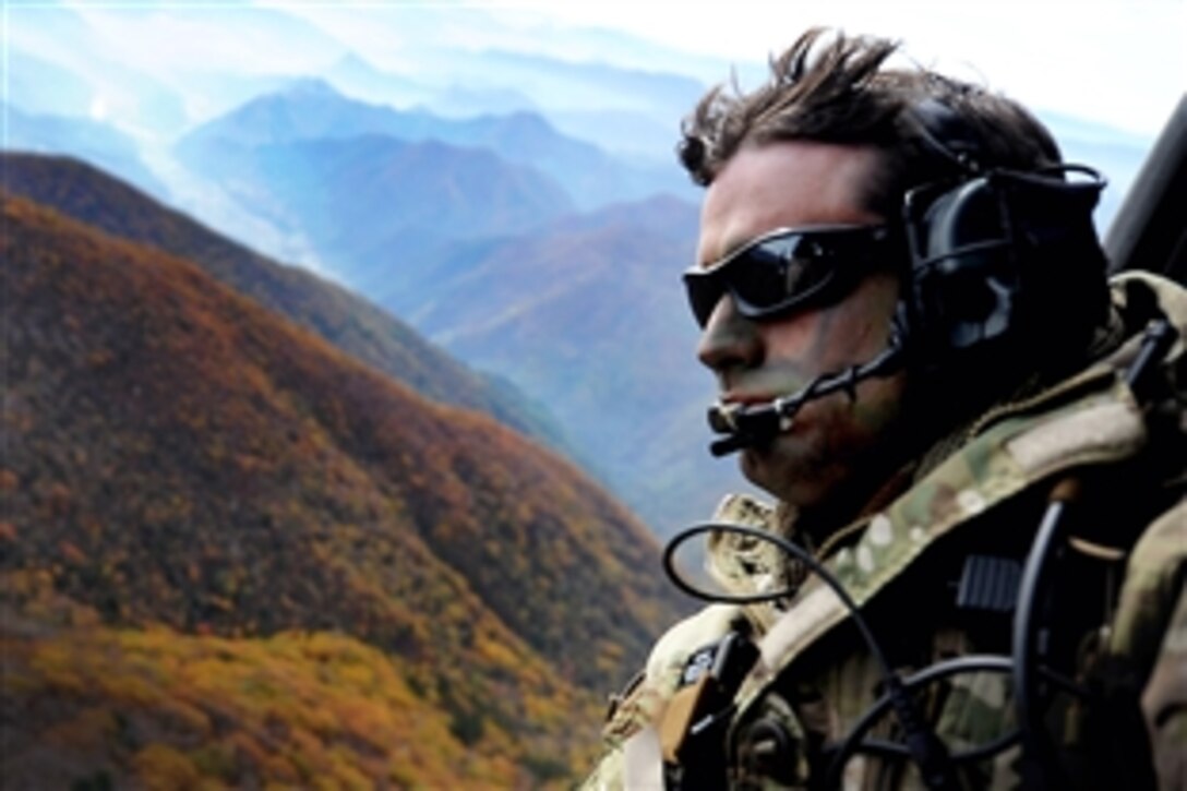 U.S. Air Force Tech. Sgt. Bobby Colliton looks out of an HH-60 Pave Hawk helicopter after performing combat survival training during exercise Pacific Thunder 2012 near Osan Air Base, South Korea, Oct. 15, 2012. Colliton, a survival evasion resistance and escape specialist, is assigned to the 18th Operation Support Squadron and the helicopter crew is assigned to the 33rd Rescue Squadron. 
