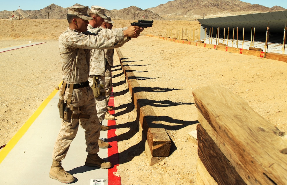 Lance Cpl. Christopher Flinng, block coach, Marksmanship Training Unit, sights in on the 7-yard line during his annual qualification practice firing stage at the Marksmanship Training Unit pistol range Oct. 16, 2012.