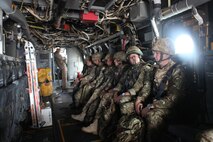 British Joint Terminal Attack Controllers aboard an MV-22B Osprey with Marine Medium Tiltrotor Squadron 162 wait to be dropped off at the landing zone where they will conduct training with U.S. Marines, Oct. 17. The training mimics conditions in theater where armed forces of different countries work together to achieve a goal.