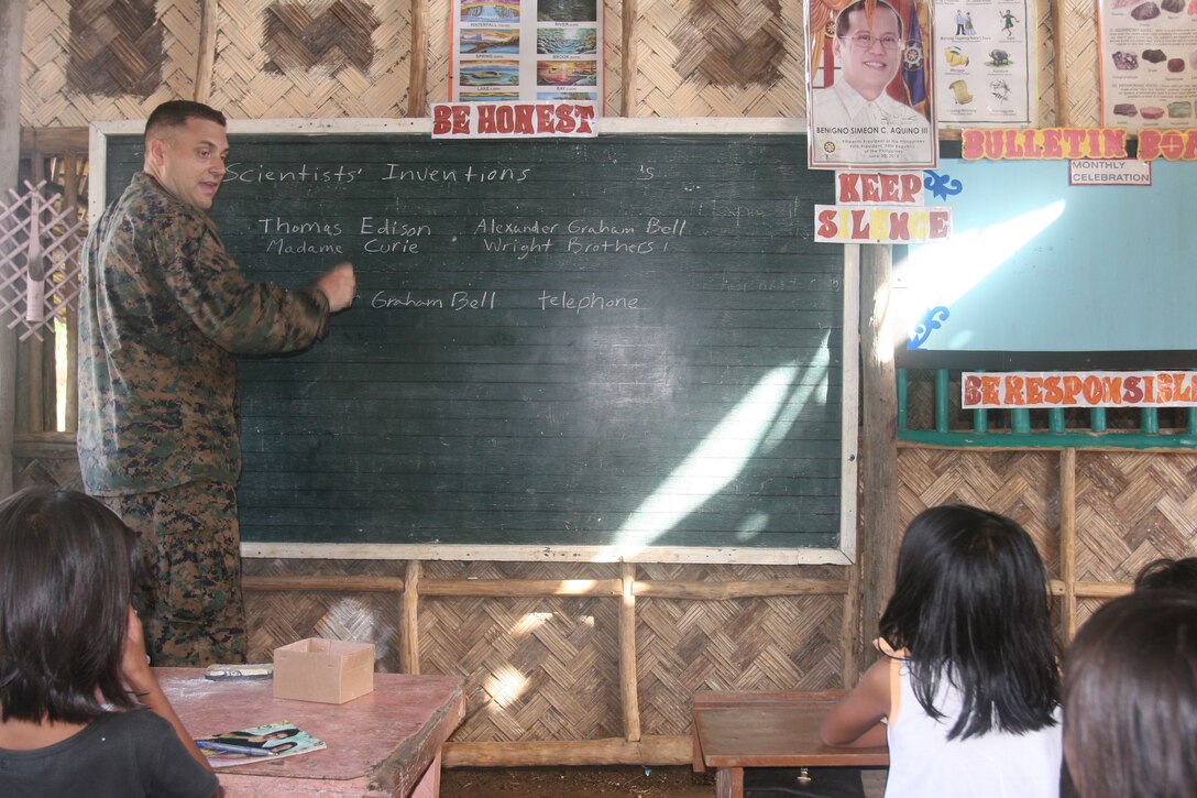 U.S. Navy Lt. Zachary Smith teaches the students of Santa Fe Elementary School an English class Oct. 13 during a community relations project as part of the bilateral Amphibious Landing Exercise (PHIBLEX) 2013. PHIBLEX 2013 is a bilateral training exercise hosted annually in the Republic of the Philippines to enhance interoperability and readiness of Armed Forces of the Philippines and U.S. Forces. Smith is the medical planner with the 31st Marine Expeditionary Unit. (U.S. Marine Corps photo by Pfc. Anne K. Henry).