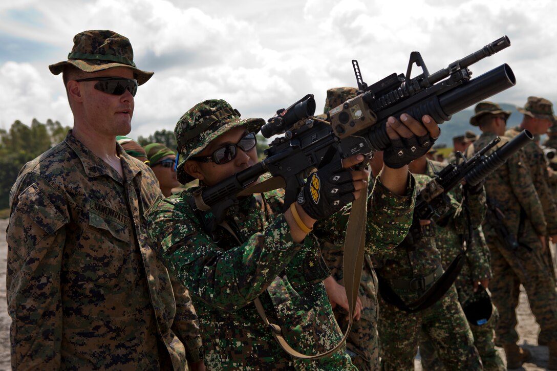 Armed Forces of the Philippines Marine Cpl. Leobert M. Barbin, 3D Marine Company, 3D Marine Battalion, fires a non-lethal round from an M203 Grenade Launcher during a non-lethal weapons training course held by U.S. Marines and Sailors assigned to 31st Marine Expeditionary Unit, III Marine Expeditionary Force during Amphibious Landing Exercise 2013 (PHIBLEX 2013) in Crow Valley, Tarlac, Republic of the Philippines, Oct. 9, 2012. PHIBLEX 2013 is a bilateral training exercise conducted annually in the Republic of the Philippines to enhance amphibious readiness of both militaries and to strengthen interoperability. (U.S. Marine Corps photo by Sgt. Matthew Troyer/Released).