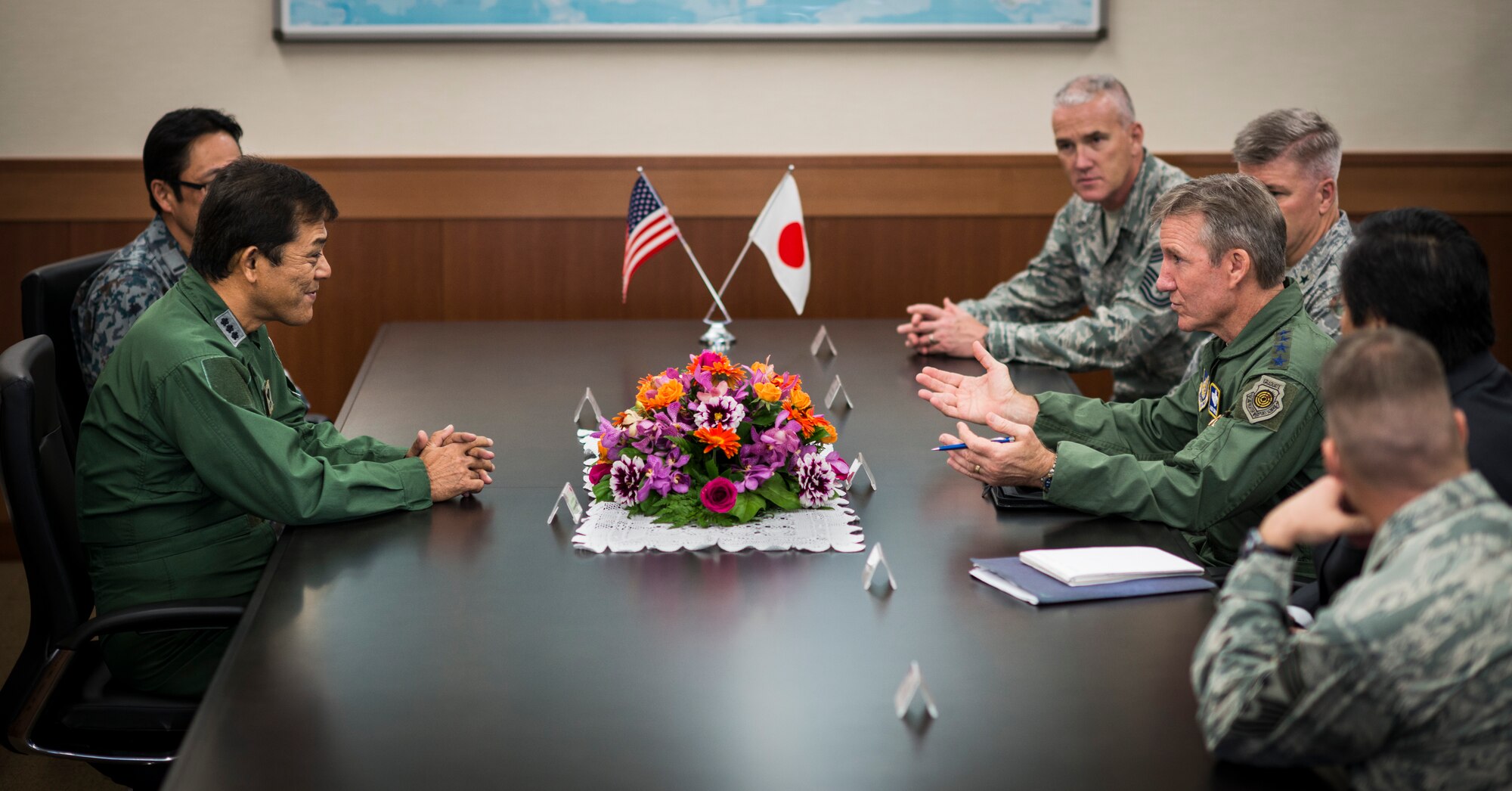 YOKOTA AIR BASE, Japan -- Gen. Herbert J. "Hawk" Carlisle, right, Pacific Air Forces commander, talks about bilateral military relations with Japan Air Self-Defense Force Lt. Gen. Harukazu Saitoh, Air Defense Command commander, during a visit to the ADC headquarters building at Yokota Air Base, Japan, Oct. 23, 2012. This was Carlisle's first visit to the new ADC headquarters. (U.S. Air Force photo by Tech. Sgt. Samuel Morse)