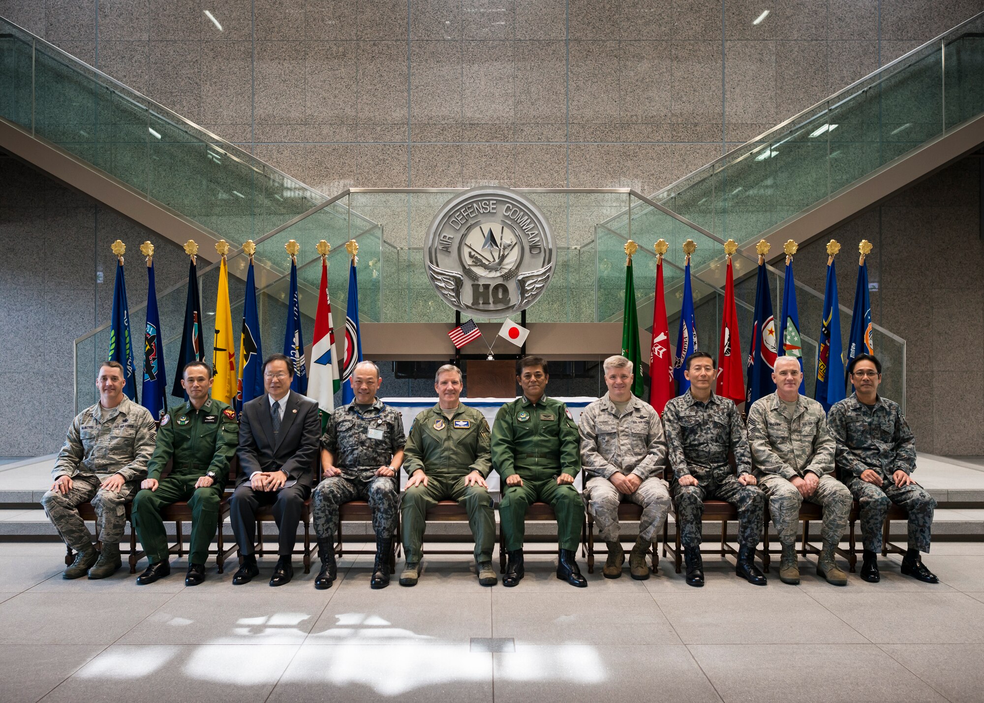 YOKOTA AIR BASE, Japan -- U.S. and Japanese military leaders pose for a group photo at the Japan Air Self-Defense Force Air Defense Command headquarters at Yokota Air Base, Japan, Oct. 23, 2012. Gen. Herbert J. "Hawk" Carlisle, Pacific Air Forces commander, visited the facility during his visit to Yokota. The ADC held the grand opening for its new facility May 30. (U.S. Air Force photo by Tech. Sgt. Samuel Morse)