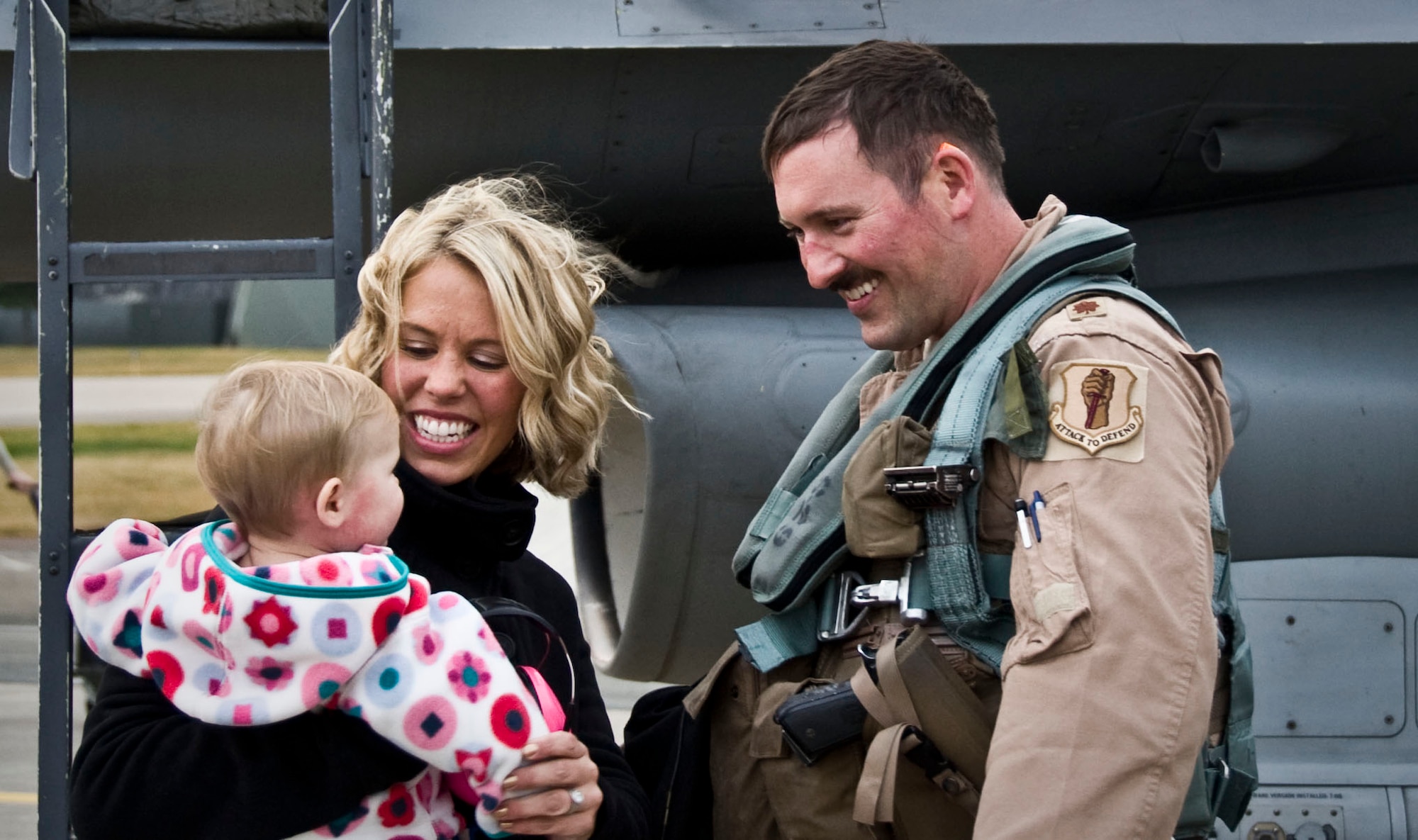U.S. Air Force Maj. Bill O’Reilly, 14th Fighter Squadron assistant director of operations, spends time with his wife and daughter at Misawa Air Base, Japan, Oct. 25, 2012. The rest of the deployed team will be returning over the next few days. (U.S. Air Force photo by Airman 1st Class Kenna Jackson)