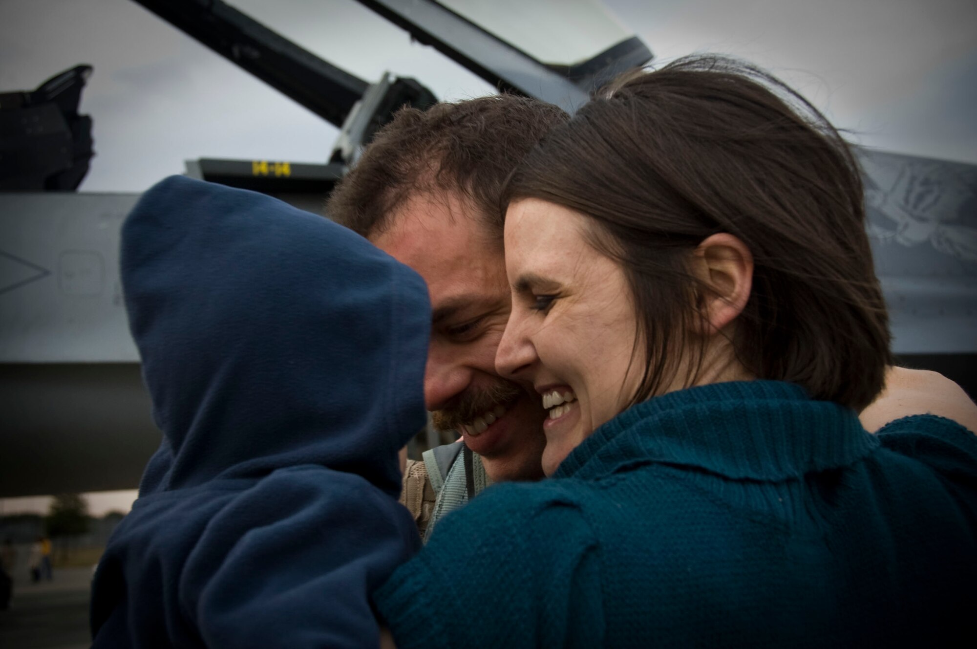 U.S. Air Force Capt. John Widmer, 14th Fighter Squadron pilot, reunites with his wife and son at Misawa Air Base, Japan, Oct. 25, 2012. Widmer was one of eight pilots who returned from a three month long deployment to Afghanistan where they supported Operation Enduring Freedom. (U.S. Air Force photo by Airman 1st Class Kenna Jackson)