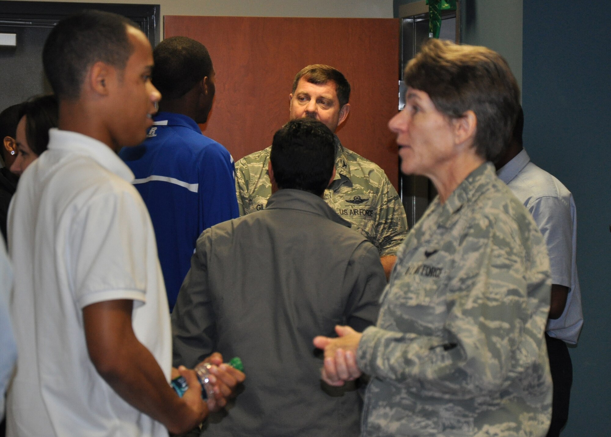 Operations Group Commander Col. Caroline Evernham talks with an aviation student from Elizabeth City State University as 916th Wing Commander Col. Greg Gilmour speaks with more students in the background. Nearly 50 educators and students from the program toured the Air Force Reserve wing on Oct. 25, 2012. (USAF photo by Ms. Donna Lea, 916ARW/PA)