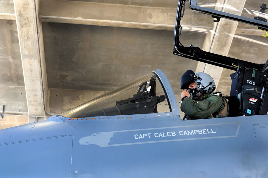 U.S. Air Force Capt. Tyler Marsh, 44th Fighter Squadron fighter pilot, prepares to fly during Exercise Beverly Bearcat 12-1, a Pacific Air Forces readiness inspection, on Kadena Air Base, Japan, Oct. 25, 2012. The inspection is being conducted to see if Kadena Airmen are ready for real-world contingencies. (U.S. Air Force photo/Airman 1st Class Brooke P. Beers) 