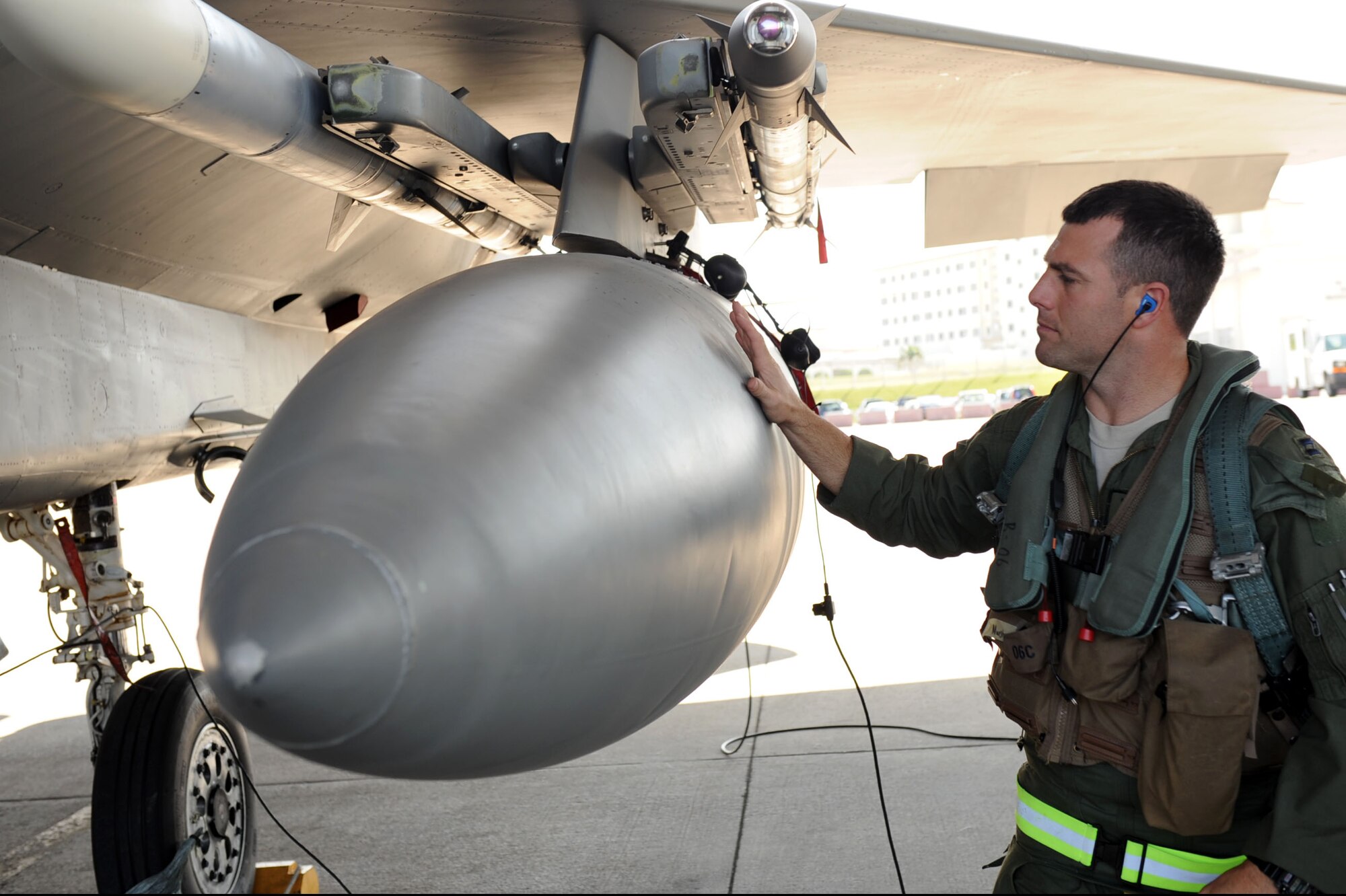U.S. Air Force Capt. Tyler Marsh, 44th Fighter Squadron fighter pilot, inspects the U.S. Air Force F-15 Eagle fighter jet he is about to fly during Exercise Beverly Bearcat 12-1, a Pacific Air Forces readiness inspection, on Kadena Air Base, Japan, Oct. 25, 2012. The inspection is being conducted to see if Kadena Airmen are ready for real-world contingencies. (U.S. Air Force photo/Airman 1st Class Brooke P. Beers)