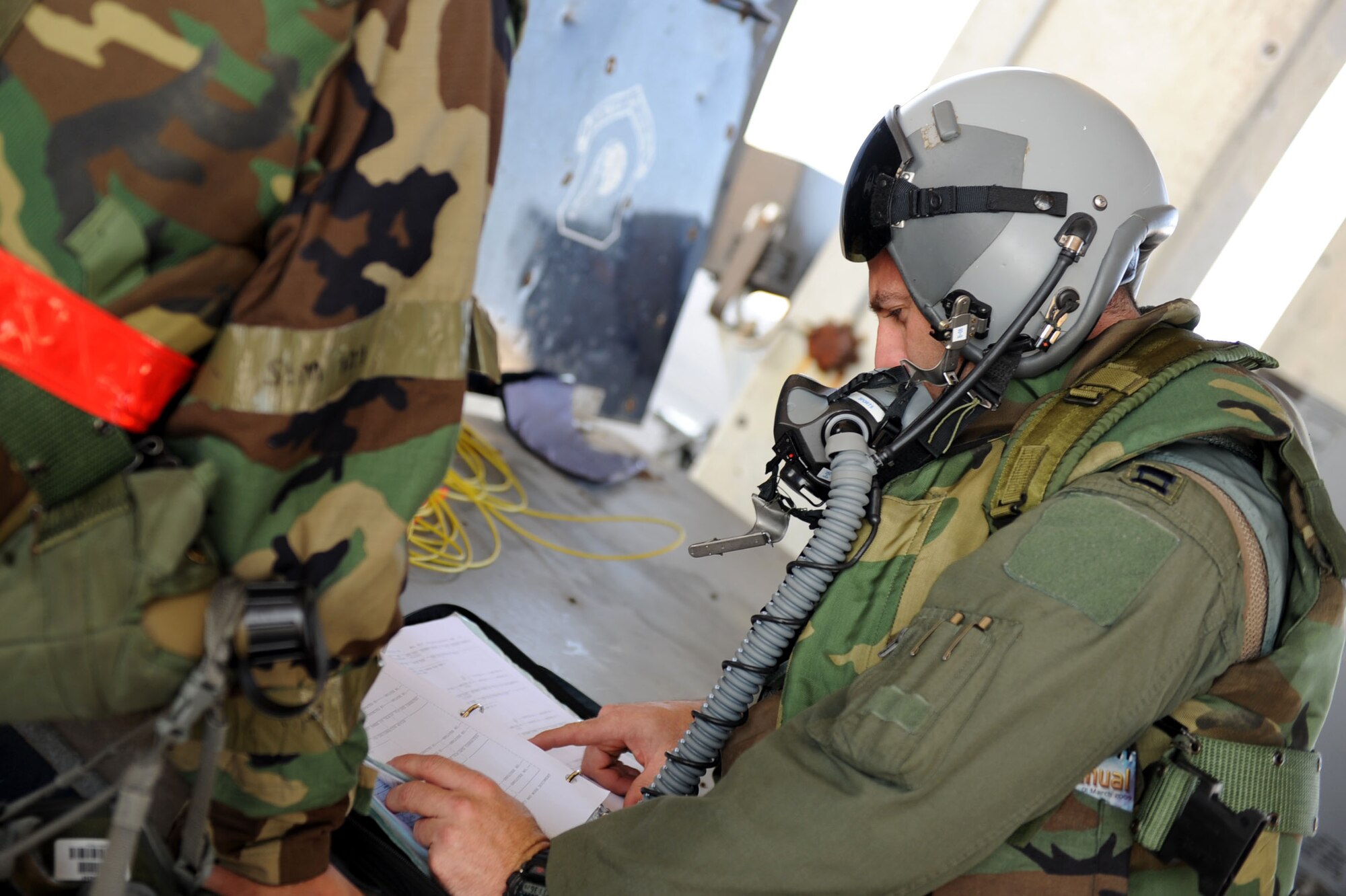 U.S. Air Force Capt. Tyler Marsh, 44th Fighter Squadron fighter pilot, reviews a checklist before flying during Exercise Beverly Bearcat 12-1, a Pacific Air Forces readiness inspection, on Kadena Air Base, Japan, Oct. 25, 2012. The inspection is being conducted to see if Kadena Airmen are ready for real-world contingencies. (U.S. Air Force photo/Airman 1st Class Brooke P. Beers)