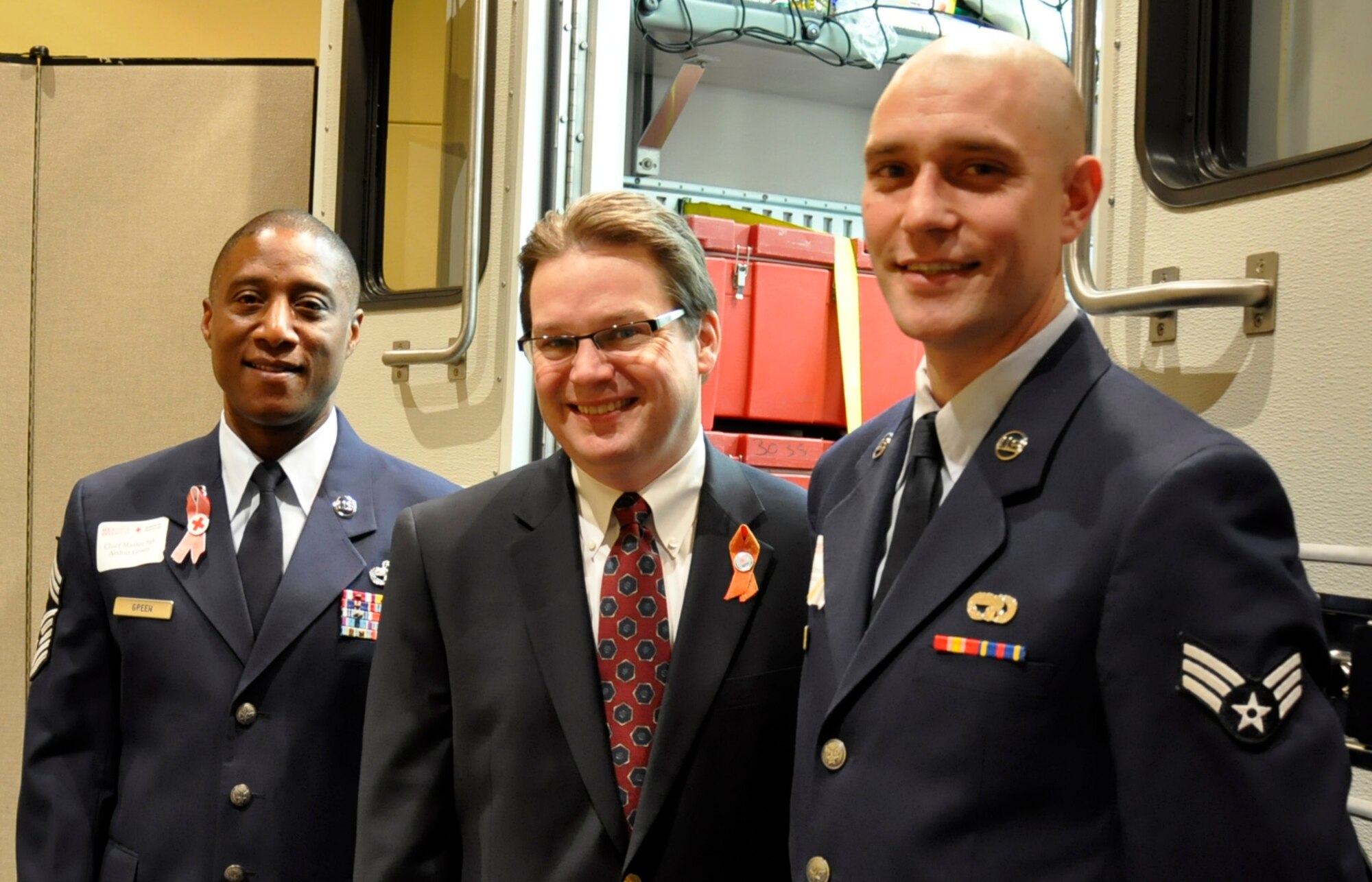 Chief Master Sgt. Arthur Green (left), 36th Aerial Port Squadron superintendent, Andy Wappler (center) vice president of Corporate Affairs, Puget Sound Energy in Tacoma, Wash., and Senior Airman Andrew Moser, 36th Aerial Port Squadron Air Transportation specialist at the Red Cross 2012 Heroes’ Breakfast, Oct. 24 at the Hotel Murano, Tacoma. Moser and Airman 1st Class Micah Myers, also with the 36th APS out of McChord Field, Wash., received the Good Samaritan Award for their valiant actions in saving a Lakewood, Wash. man’s life, June 2 during the Reserve drill weekend. Green accepted the award on the absent Myer’s behalf and Wappler presented the award. (U.S. Air Force photo by Master Sgt. Jake Chappelle)