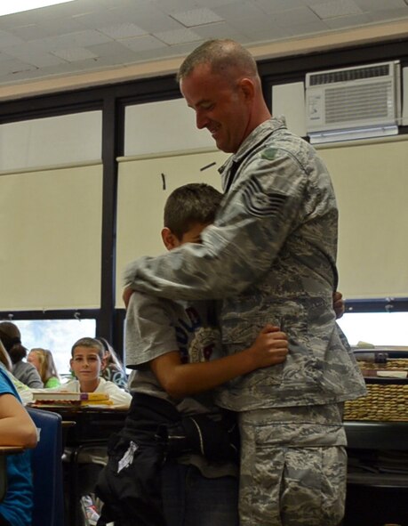 TSgt. Lahair, 439th Security Forces, returned home Thursday morning following a six-month deployment to Southwest Asia and surprised his son, Trent at school. About 20 deployed reservists reunited with their families at the Security Forces Squadron building. (U.S. Air Force photo by SrA Kelly Galloway)