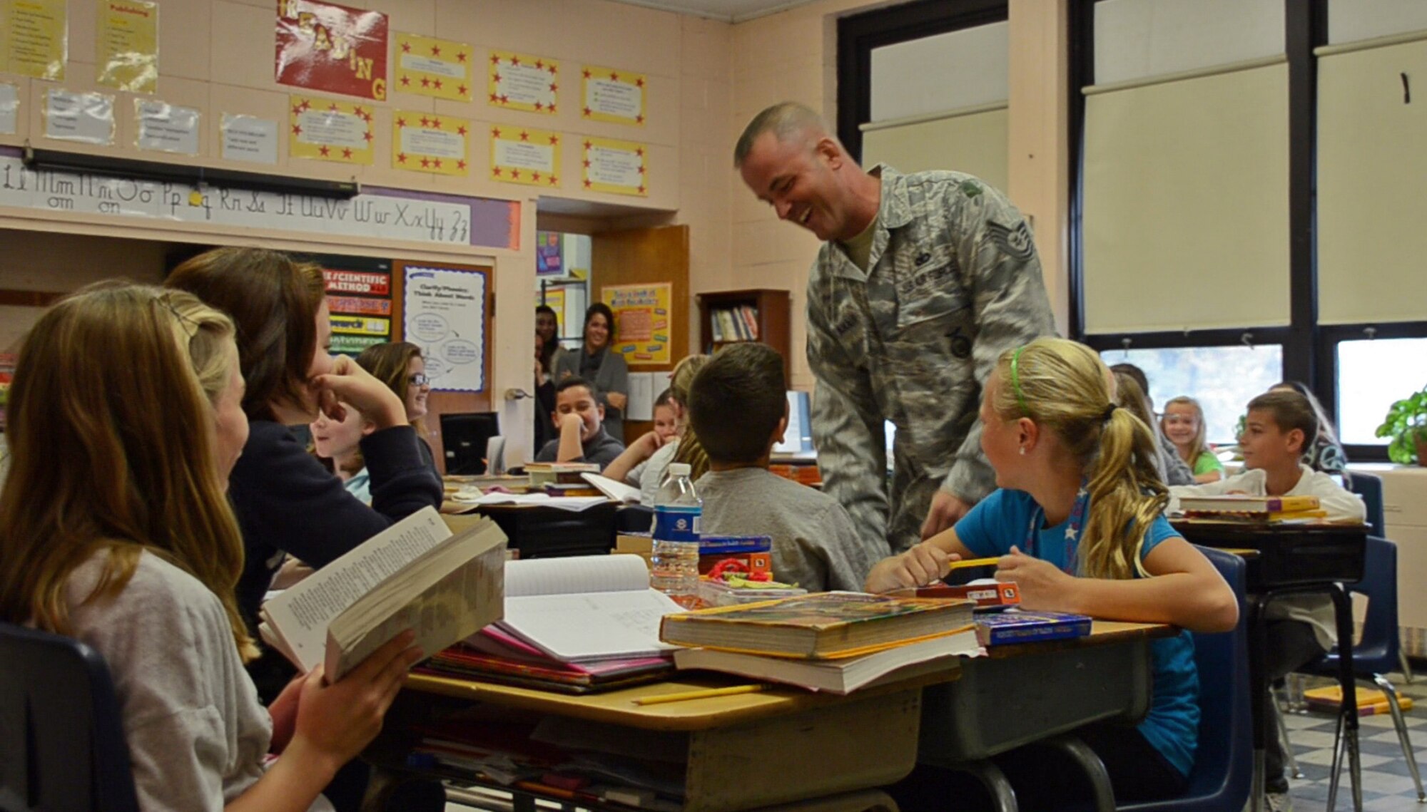 TSgt. Lahair, 439th Security Forces, returned home Thursday morning following a six-month deployment to Southwest Asia and surprised his son, Trent at school. About 20 deployed reservists reunited with their families at the Security Forces Squadron building. (U.S. Air Force photo by SrA Kelly Galloway)