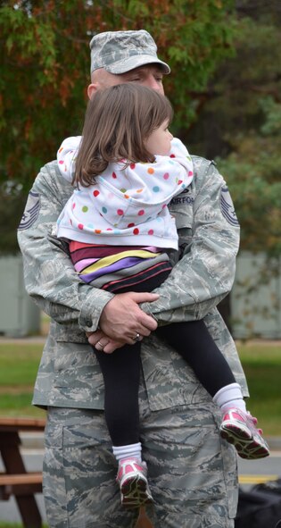Members of the 439th Security Forces Squadron arrived at Westover Air Reserve Base Thursday morning following a six-month deployment to Southwest Asia. About 20 deployed reservists reunited with their families at the Security Forces Squadron building. (U.S. Air Force photo by SrA Kelly Galloway)