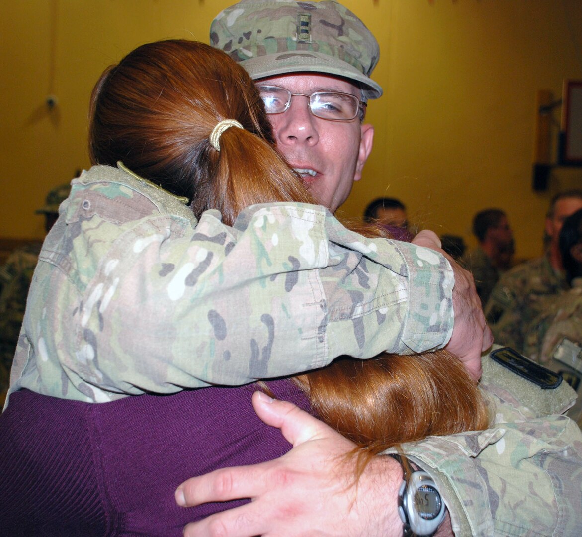 Family members greet Soldiers with hugs and kisses after the 14th Military Intelligence Battalion was dismissed. The Soldiers will have some reintegration training during their first week home, then have 30 days of leave before resuming their military duties.
Photo by Gregory Ripps