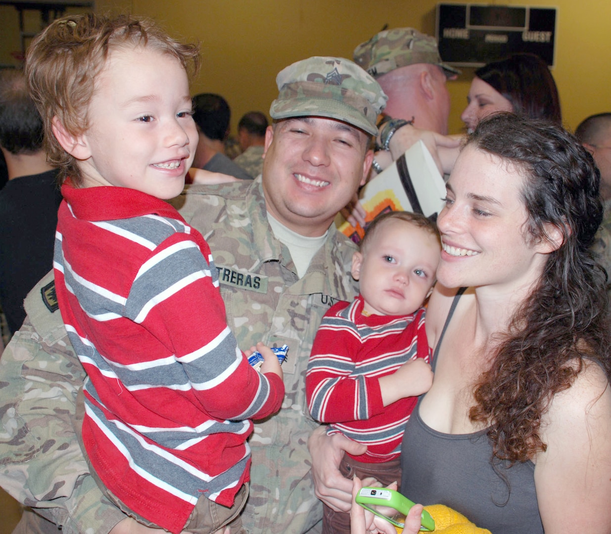 Family members greet Soldiers with hugs and kisses after the 14th Military Intelligence Battalion was dismissed. The Soldiers will have some reintegration training during their first week home, then have 30 days of leave before resuming their military duties.
Photo by Gregory Ripps