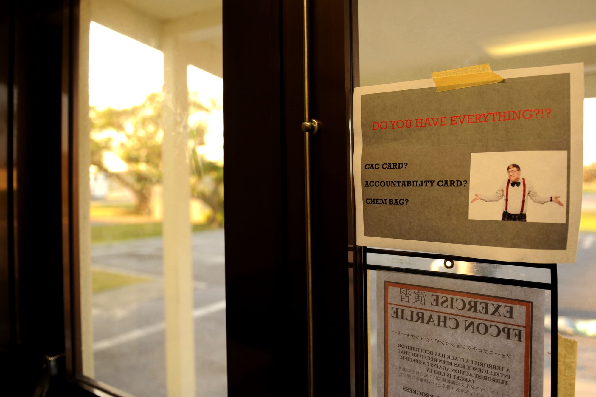 A sign at the single point of entry at the 18th Wing Public Affairs building, reminds Airmen to double check that they have everything they need before exiting the building during a Pacific Air Forces readiness inspection, Exercise Beverly Bearcat 12-1, on Kadena Air Base, Japan, Oct. 25, 2012. The inspection is an exercise conducted by PACAF to ensure Kadena Airmen are ready for real-world contingencies. (U.S. Air Force photo/Airman 1st Class Brooke P. Beers)