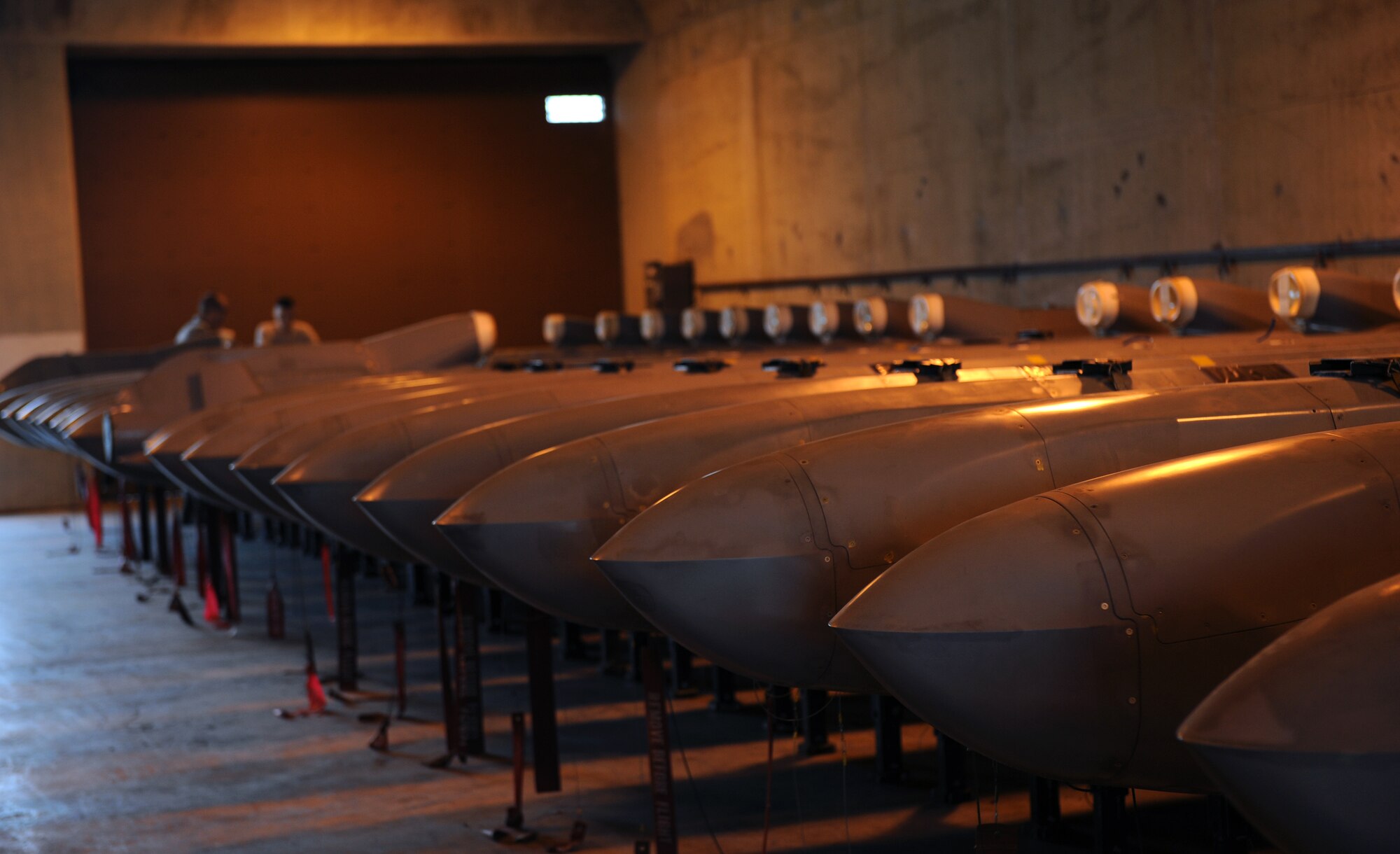 Conventional Air-Launched Cruise Missiles are lined up in a 2nd Munitions Squadron facility on Barksdale Air Force Base, La., Oct. 25. Once a CALCM is launched from a B-52H Stratofortress, the missile's wings deploy and the fuel system activates, putting the missile in free flight. Each CALCM weighs approximately 3,500 pounds. (U.S. Air Force photo/Airman 1st Class Benjamin Gonsier)(RELEASED)
