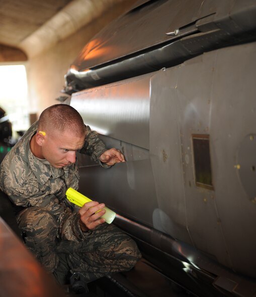 Staff Sgt. Edward Caldwell, 2nd Munitions Squadron missile maintenance team chief, checks a Conventional Air-Launched Cruise Missile for damage during a CALCM generation exercise on Barksdale Air Force Base, La., Oct. 25. Once the CALCM return to the facility they go through a recertification process, where Airmen check for any damage or defects that might have occurred during the transportation and handling process. If any damage is spotted, the CALCM will either be fixed on the spot or transported for repairs. (U.S. Air Force photo/Airman 1st Class Benjamin Gonsier)(RELEASED)