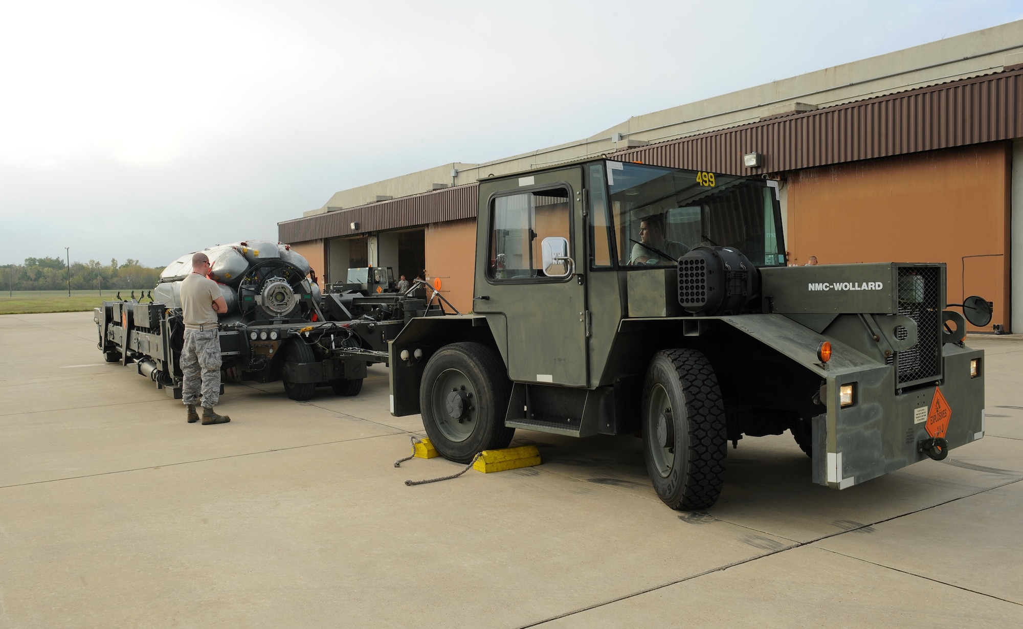 Airmen from the 2nd Munitions Squadron ensure the brakes on an MB-4 tug are working properly before transporting a common strategic rotary launcher containing eight Conventional Air-Launched Cruise Missiles during a CALCM generation exercise on Barksdale Air Force Base, La., Oct. 25. Before transporting munitions, 2 MUNS Airmen perform safety checks to ensure the assets are safe for towing. (U.S. Air Force photo/Airman 1st Class Benjamin Gonsier)(RELEASED)
