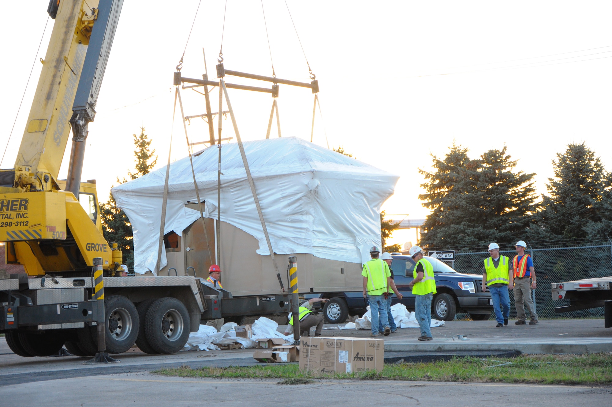 The new Gate 1A guard house is lowered into place.  (photo by Niki Jahns)  