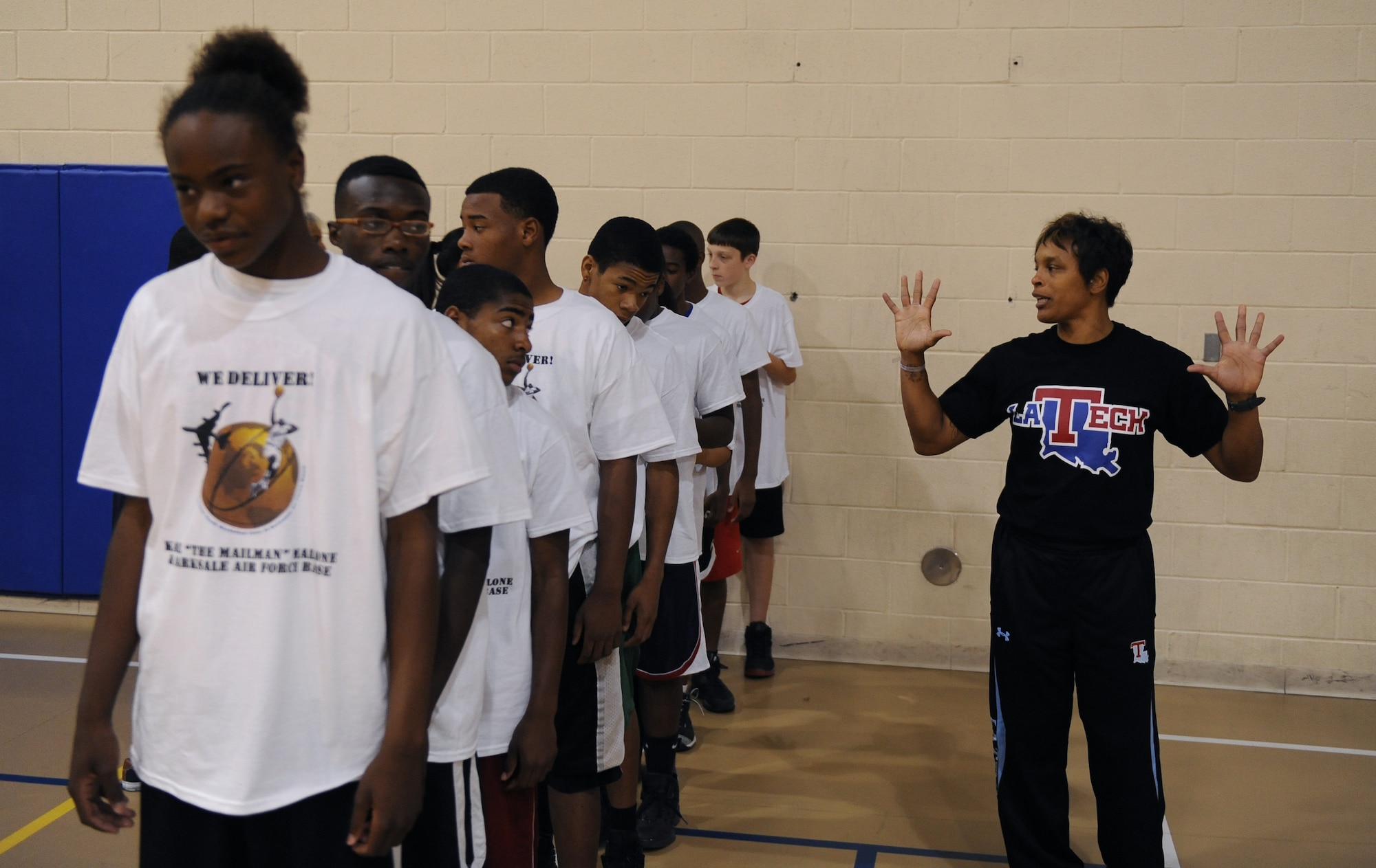 Teresa Weatherspoon, Louisiana Tech women?s basketball coach and retired WNBA player, gives participants in the Karl Malone Basketball Clinic instructions during a team building exercise on Barksdale Air Force Base, La., Oct. 20. For the team building exercise, participants had to line up with a balloon between each other and walk across the court without letting any of the balloons fall. The participants were not allowed to use their hands to adjust or hold the balloons. (U.S. Air Force photo/Senior Airman Micaiah Anthony)(RELEASED)