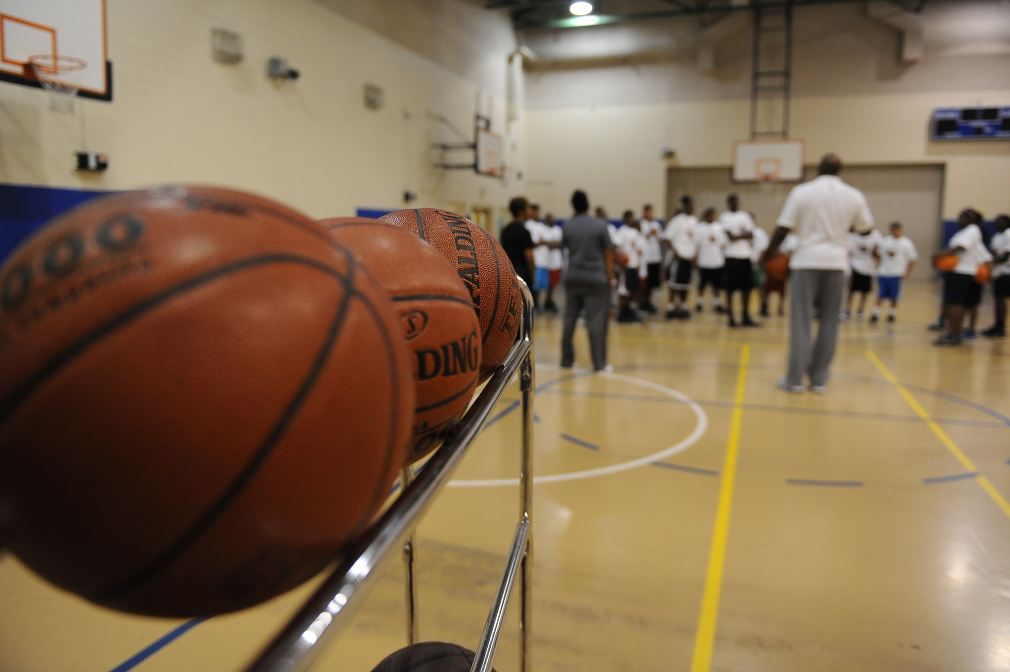 Instructors talk to Barksdale?s youth during the Karl Malone Basketball Clinic on Barksdale Air Force Base, La., Oct. 20. During the clinic, Barksdale?s youth learned the fundamentals of basketball along with life lessons ranging from listening to parents to doing well in school. (U.S. Air Force photo/Senior Airman Micaiah Anthony)(RELEASED)