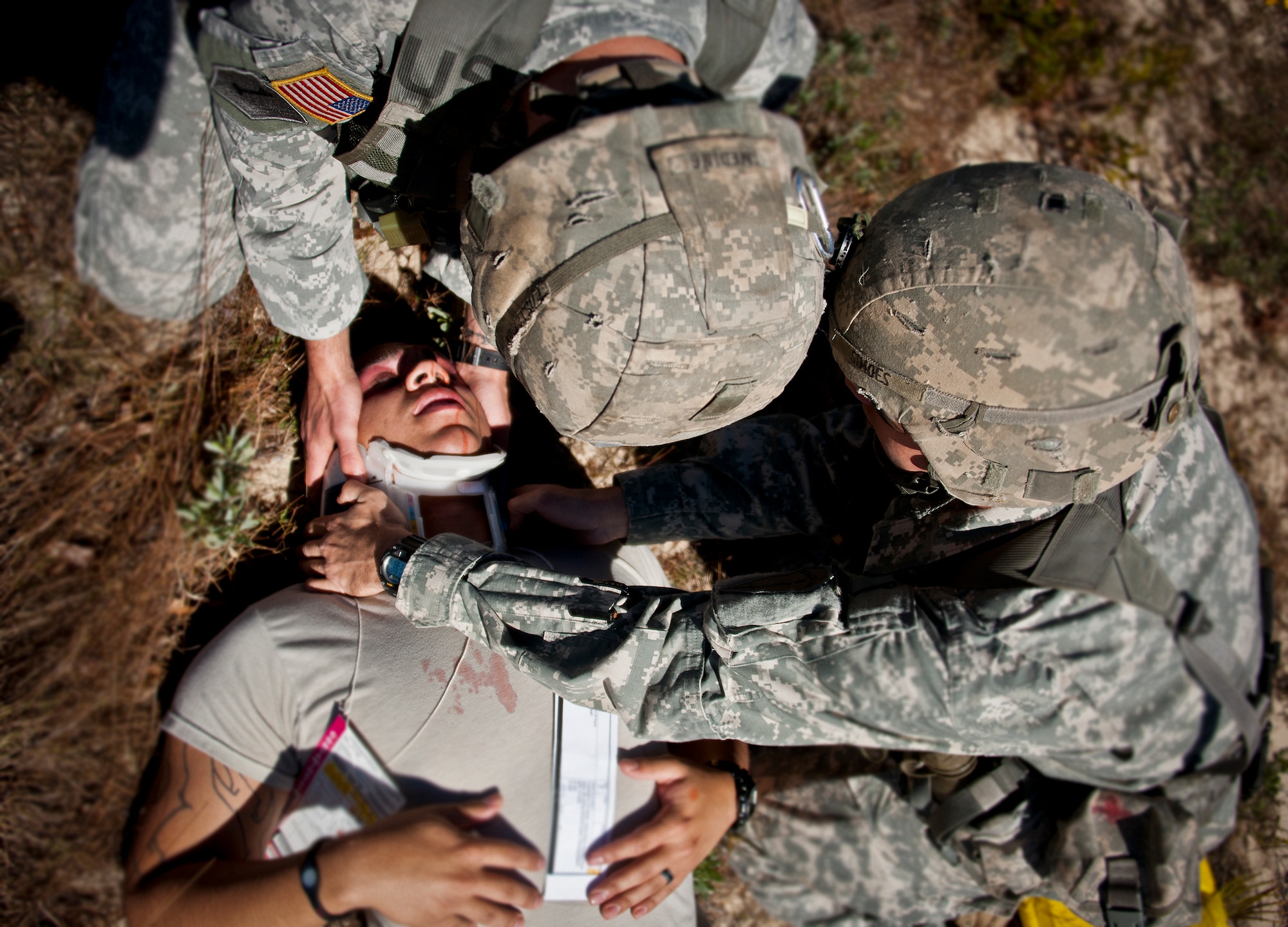 Army medics secure a simulated victim’s head during a downed aircraft exercise on the Eglin range, Oct. 20.  The 6th Ranger Training Battalion, Team Eglin’s emergency responders and local medical facilities participated in the exercise that simulated a helicopter crash with 12 Soldiers injured deep within the Eglin range.  The victims were either evacuated by helicopter or by ambulance to area hospitals.  The annual exercise was to validate the battalion’s emergency procedures and test their communication with Team Eglin and local emergency and medical units.  (U.S. Air Force photo/Samuel King Jr.)