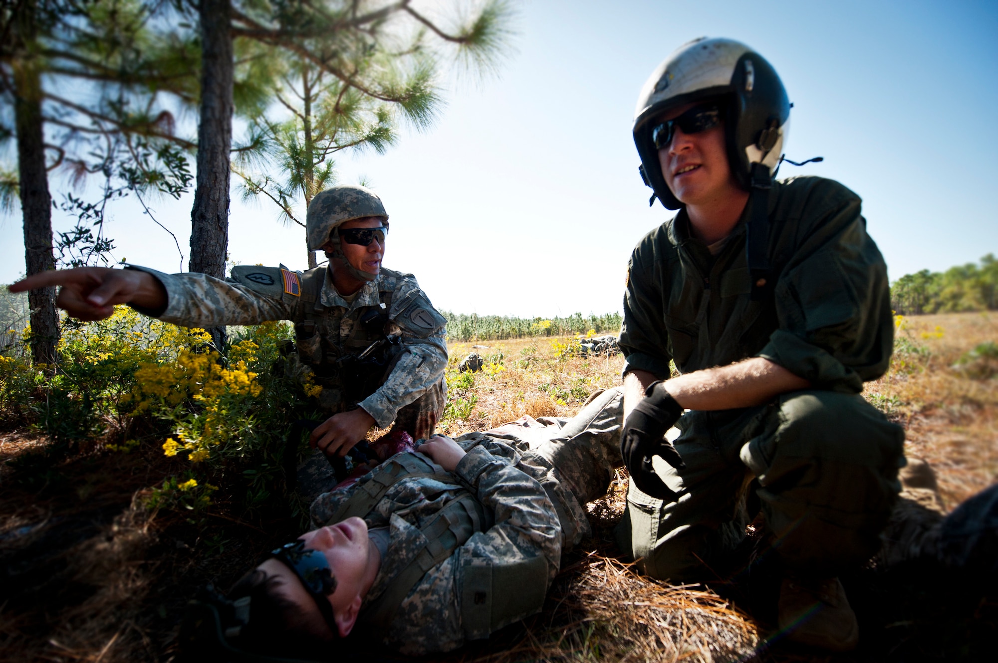 Sgt. 1st Class Brian Thomas and Spc. Ben Richardson, of the 6th Ranger Training Battalion, talk over their plan of action to help the victims of a simulated helicopter crash during an exercise on the Eglin range, Oct. 20.  The 6 RTB, Team Eglin’s emergency responders and local medical facilities participated in the exercise that simulated a helicopter crash with 12 Soldiers injured deep within the Eglin range.  The victims were either evacuated by helicopter or by ambulance to area hospitals.  The annual exercise was to validate the battalion’s emergency procedures and test their communication with Team Eglin and local emergency and medical units.  (U.S. Air Force photo/Samuel King Jr.)