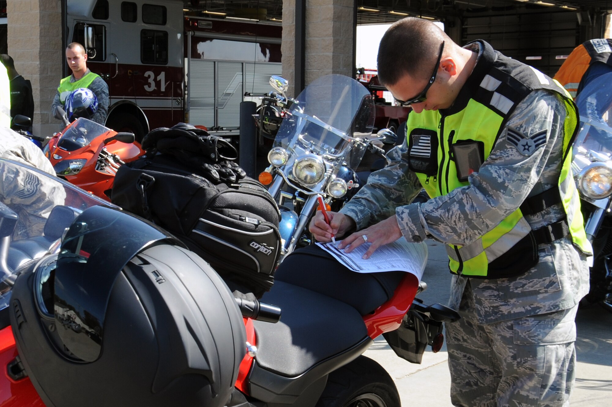 U.S. Air Force Senior Airman Andrew Hostetter, 4th Contracting Squadron contract specialist, checks off a motorcycle inspection checklist before riding at the base fire department on Seymour Johnson Air Force Base, N.C., Oct. 19, 2012. The 4th Mission Support Group held refresher training for those wishing to ride motorcycles on base. (U.S. Air Force photo/Airman 1st Class John Nieves Camacho/Released)