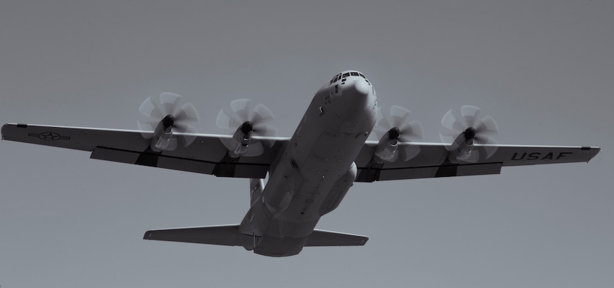 A C-130J performs a flyover during Impact Day Oct. 19, 2012, at Dyess Air Force Base, Texas. Maintainers from the 317th Airlift Group learned the outcome of generating an aircraft when it flies and resupplies a drop zone. (U.S. Air Force photo by Airman 1st Class Jonathan Stefanko/ Released)