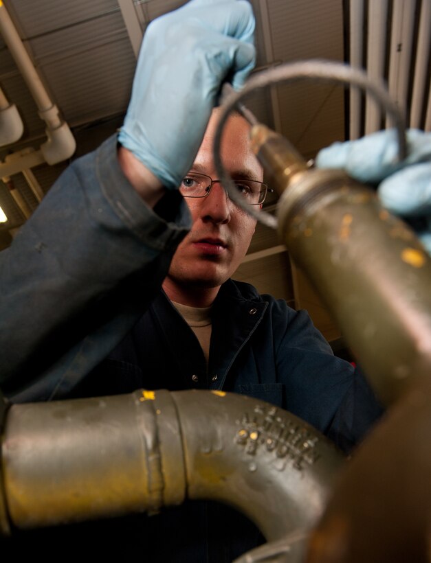 Staff Sgt. Joshua Baldwin, 28th Logistics Readiness Squadron refueling maintenance mechanic, installs a new gasket on a master meter during scheduled maintenance in the fuels shop at Ellsworth Air Force Base, S.D., Oct. 16, 2012. This master meter, in use continuously since 1959, has proven to be extraordinarily cost efficient, requiring only minor repairs and maintenance during its over five decades of service. (U.S. Air Force photo by Airman 1st Class Kate Thornton-Maurer/Released)