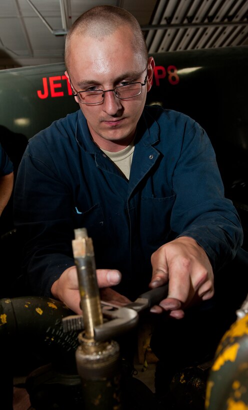 Staff Sgt. Joshua Baldwin, 28th Logistics Readiness Squadron refueling maintenance mechanic, removes a gasket from a master meter during scheduled maintenance in the fuels shop at Ellsworth Air Force Base, S.D., Oct. 16, 2012. The master meter calibrates all fuel meters on base to ensure accurate readings and efficient use of resources. (U.S. Air Force photo by Airman 1st Class Kate Thornton-Maurer/Released)