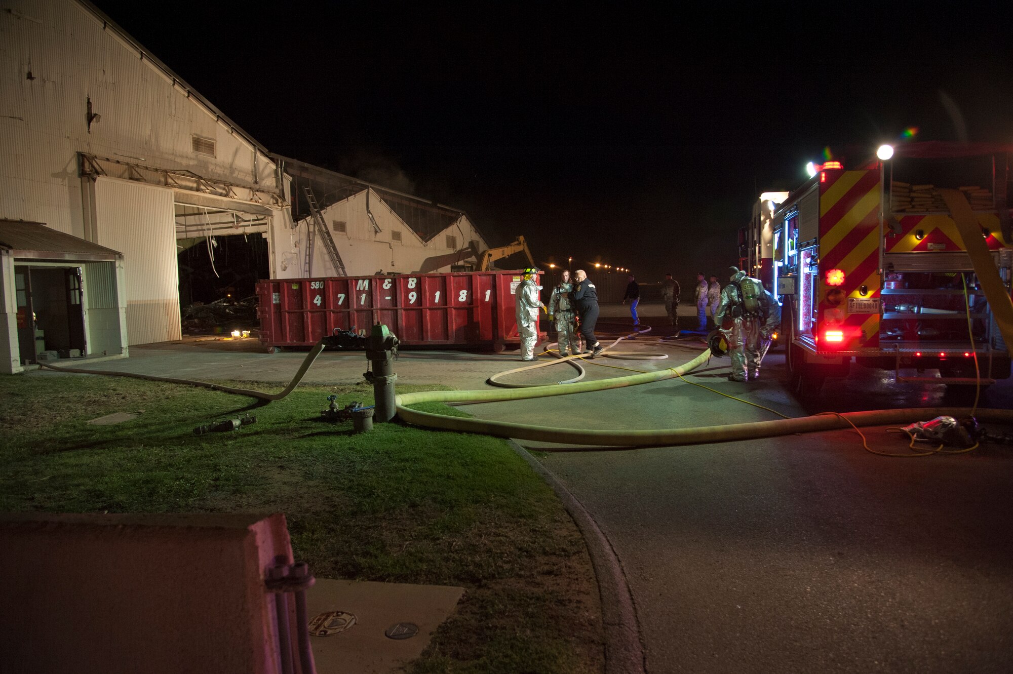 ALTUS AIR FORCE BASE, Okla. -- Firefighters from the 97th Civil Engineer Squadron fire department respond to a fire at a vacant building on base Oct. 24, 2012. The cause of the fire is unknown at this time. (U.S. Air Force photo by Senior Airman Kenneth W. Norman / Released)