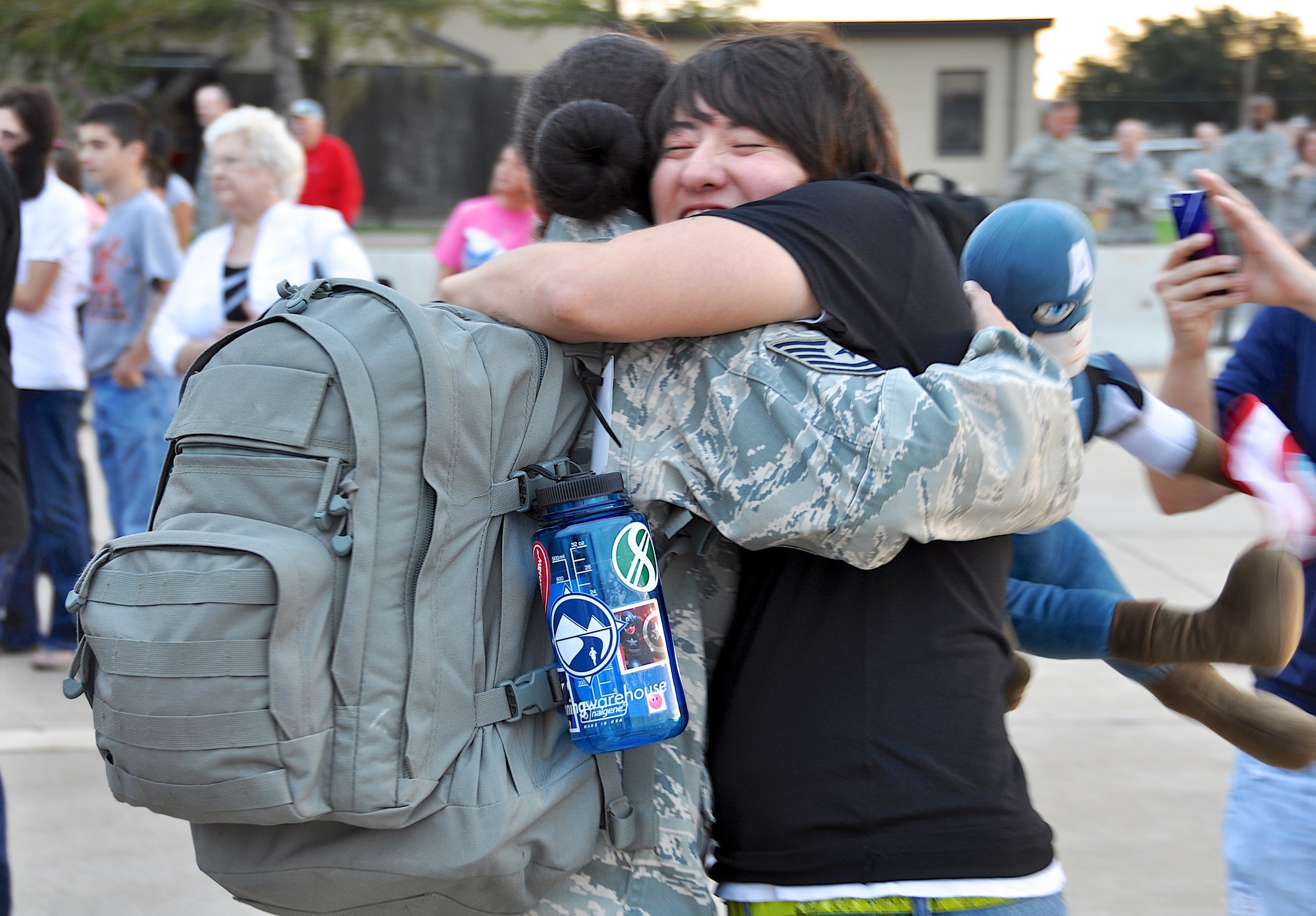 Greeted by open arms are more than 50 deployed members from the 301st Security Forces Squadron and 610th Security Forces Squadron, stationed at Naval Air Station Fort Worth Joint Reserve Base, Texas, after returning Oct. 25, 2012. The members were deployed to Saudi Arabia for six months in support of Operation Enduring Freedom. A large group of 301st Fighter Wing family and friends gathered to welcome our returning Airmen home.