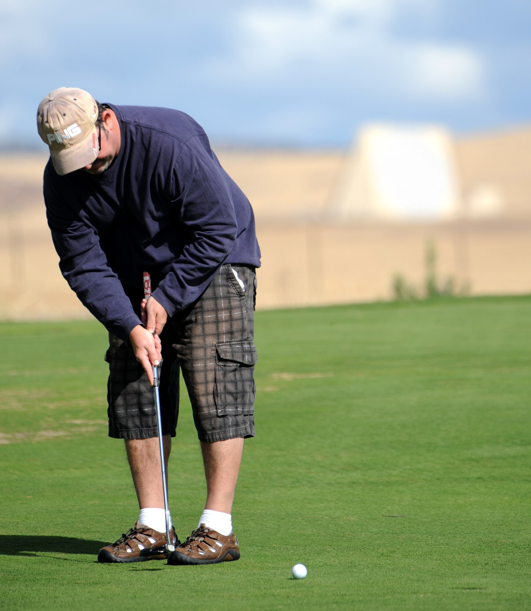 Donald Payne, 9th Force Support Squadron performs a putt during the Intramural Golf Championships at the Coyote Run Golf Course Beale Air Force Base, Calif., Oct. 23, 2012. The 9th FSS was defeated by the 13th Intelligence Squadron. (U.S. Air Force photo by Staff Sgt. Robert M. Trujillo/Released)