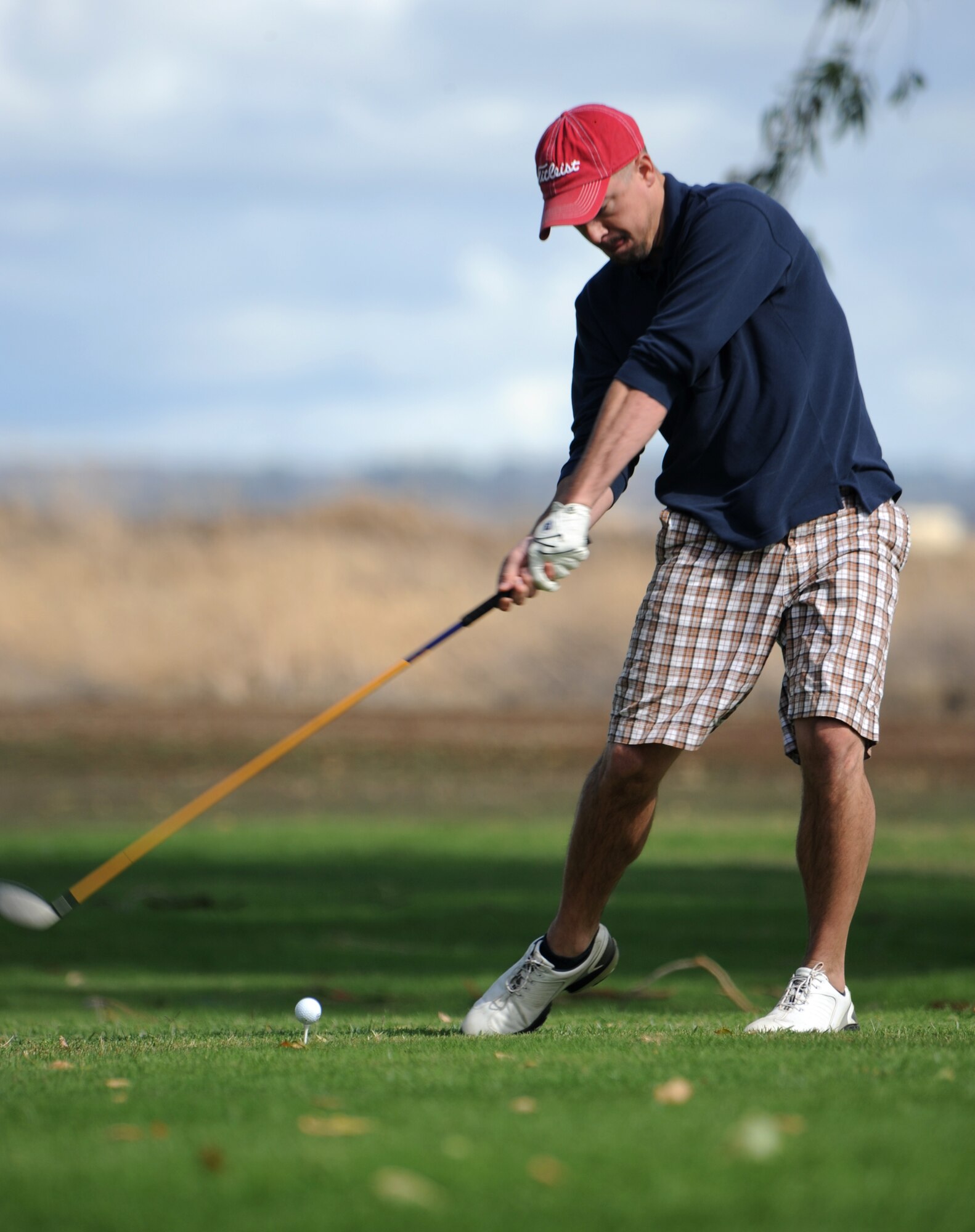 Airman 1st Class Scott Reynolds tees off during the Intramural Golf Championships at the Coyote Run Golf Course Beale Air Force Base, Calif., Oct. 23, 2012. The championship concluded with the 13th Intelligence Squadron defeating 9th Force Support Squadron. (U.S. Air Force photo by Staff Sgt. Robert M. Trujillo/Released)