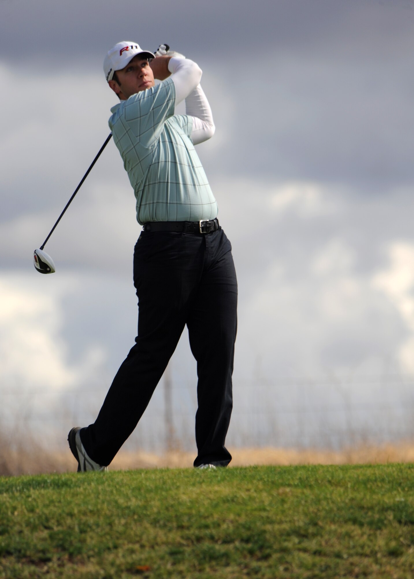 Airman 1st Class Mathew Green tees off during the Intramural Golf Championships at the Coyote Run Golf Course Beale Air Force Base, Calif., Oct. 23, 2012. The championship concluded with the 13th Intelligence Squadron defeating 9th Force Support Squadron on the 18th hole. (U.S. Air Force photo by Staff Sgt. Robert M. Trujillo/Released)