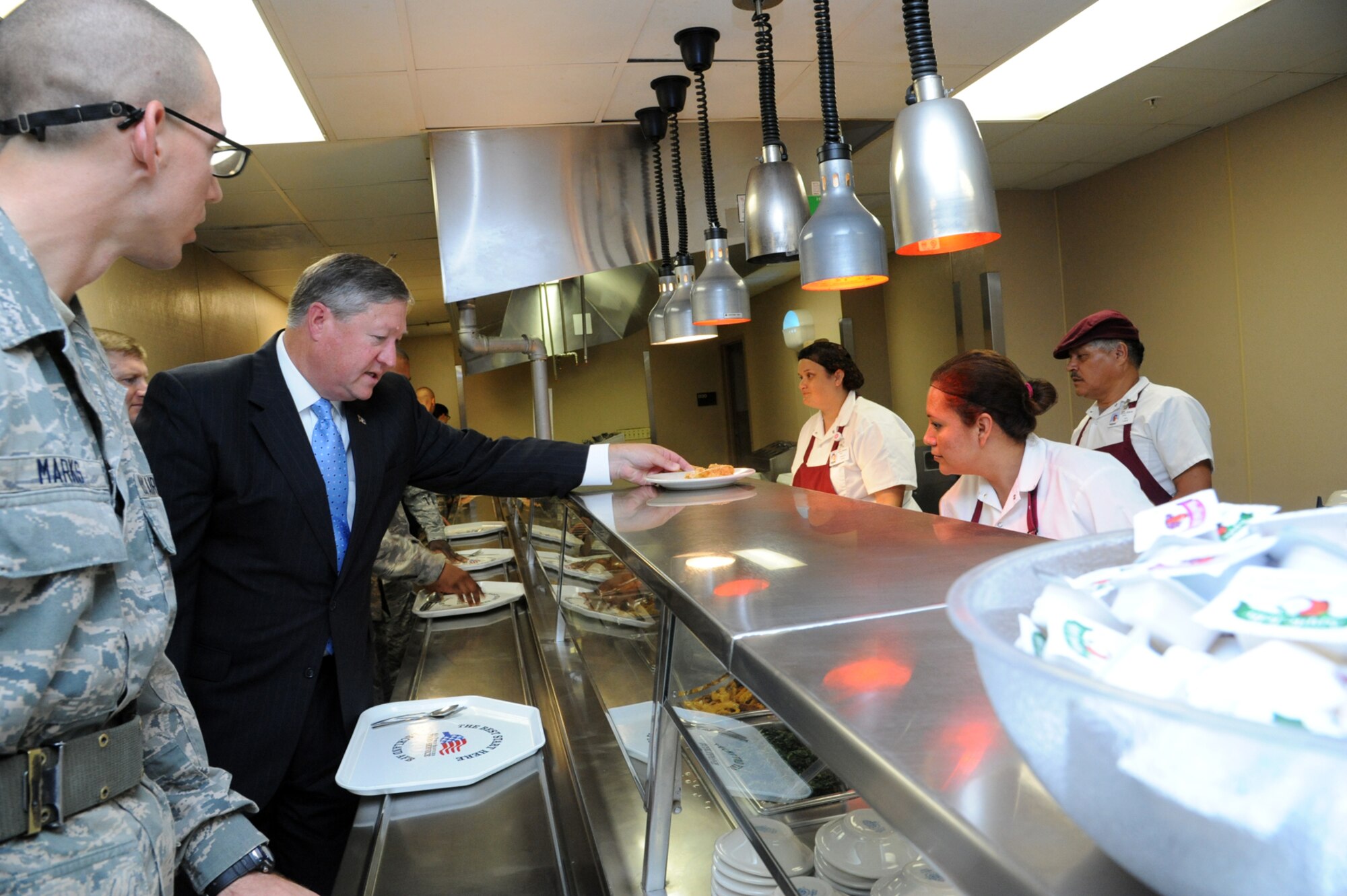 Secretary of the Air Force Michael Donley orders lunch at the basic military training dining facility. Donley ate lunch with trainees and gained their perspective of life in the Air Force. (U.S. Air Force photo by Rich McFadden)