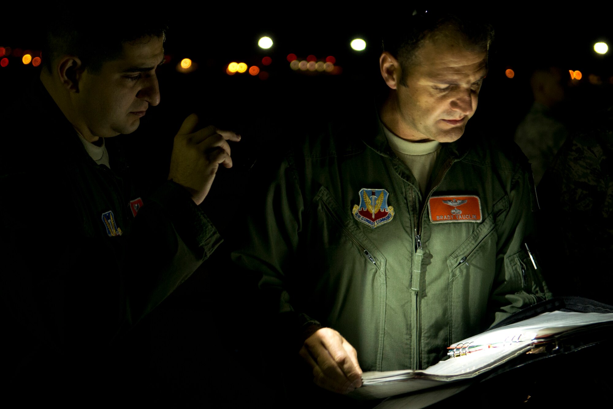 U.S. Air Force Lt. Col. Brady Vauclin, 49th Test and Evaluation Squadron pilot, checks the aircraft forms of a 93rd Bomb Squadron aircraft prior to a test flight of the Counter-electronics High-Power microwave Advanced Missile, Oct. 16, 2012, Nellis Air Force Base, Nev. The operational flight test of the missile may change future warfare by providing the military with a nonlethal system which is capable of degrading, damaging and destroying electronic systems while minimizing collateral damage. (U.S. Air Force photo by Master Sgt. Greg Steele/Released)