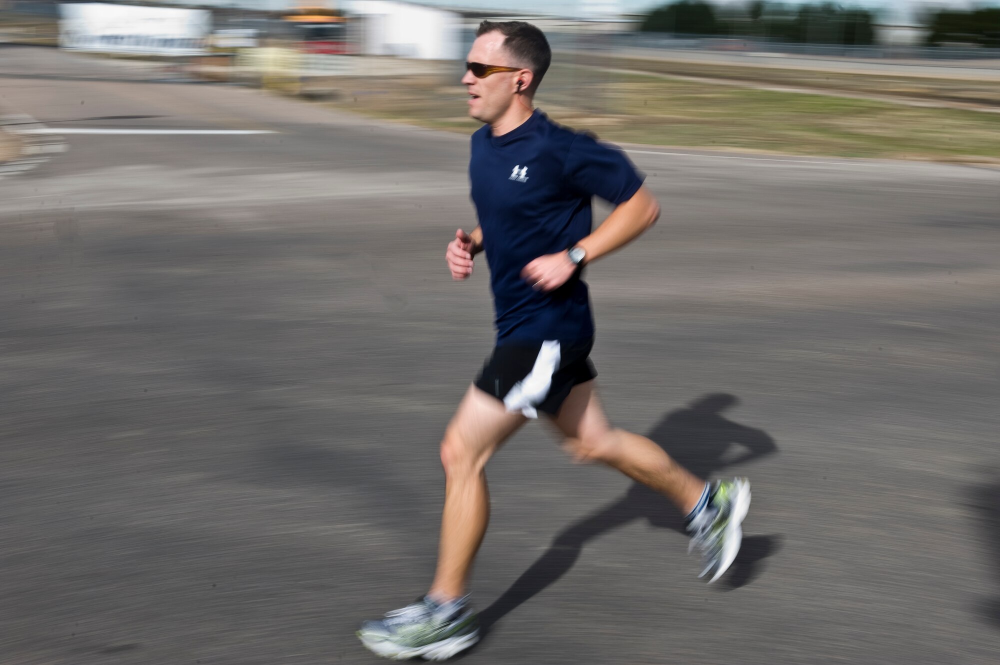BUCKLEY AIR FORCE BASE, Colo. – Staff Sgt. Matthew Mayo, 460th Contracting Flight, sprints the last portion of the Breast Cancer Awareness 5K Run/Walk Oct. 19, 2012, near the fitness center. The race was hosted by the Health and Wellness Center to show their support for victims and their families, promote cancer awareness, and celebrate survivors.  (U.S. Air Force photo by Airman 1st Class Riley Johnson)