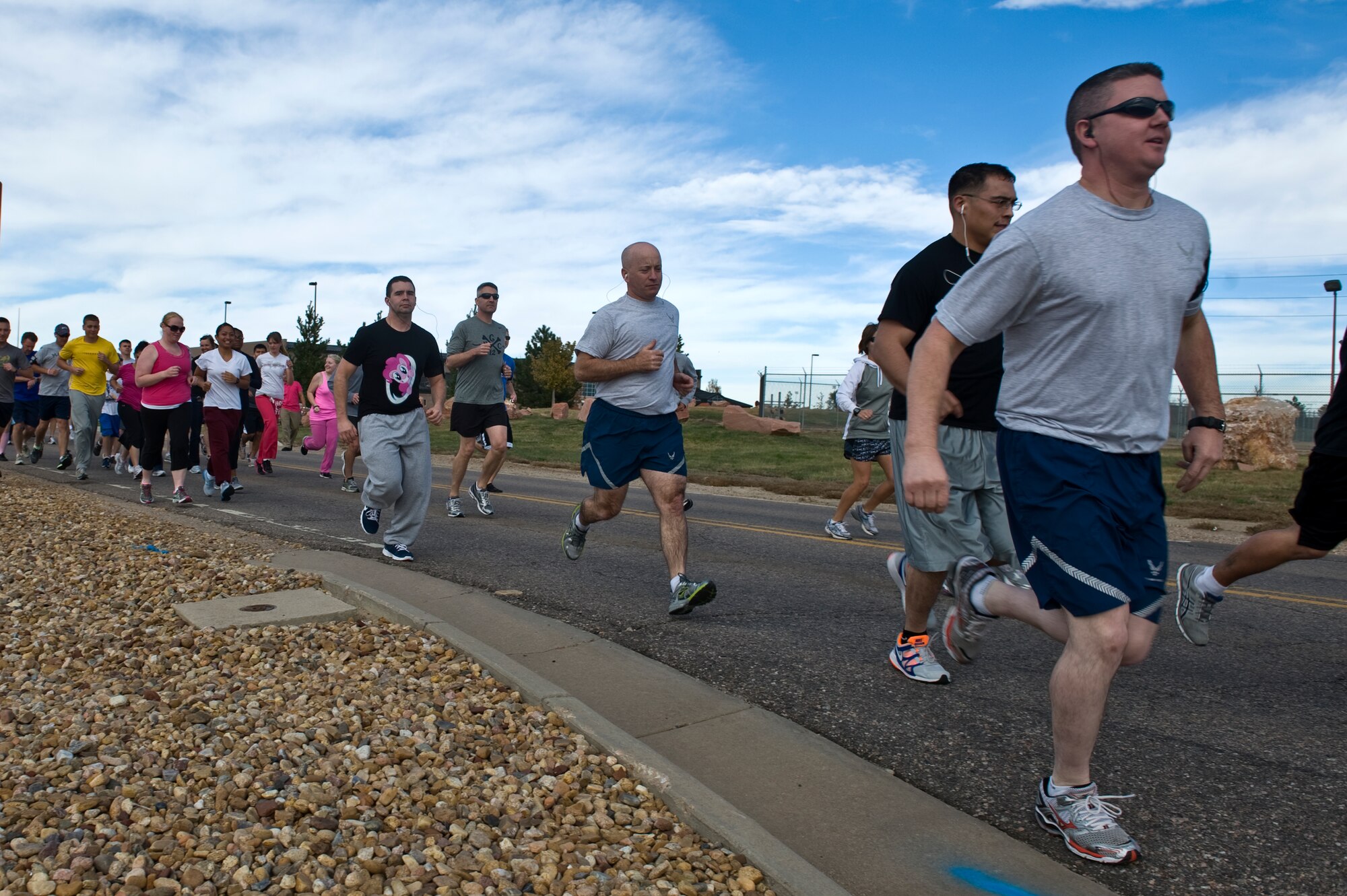 BUCKLEY AIR FORCE BASE, Colo. – Team Buckley members compete in the Breast Cancer Awareness 5K Run/Walk Oct. 19, 2012, near the fitness center. Approximately 80 people participated in the race hosted by the Health and Wellness Center. (U.S. Air Force photo by Airman 1st Class Riley Johnson) 