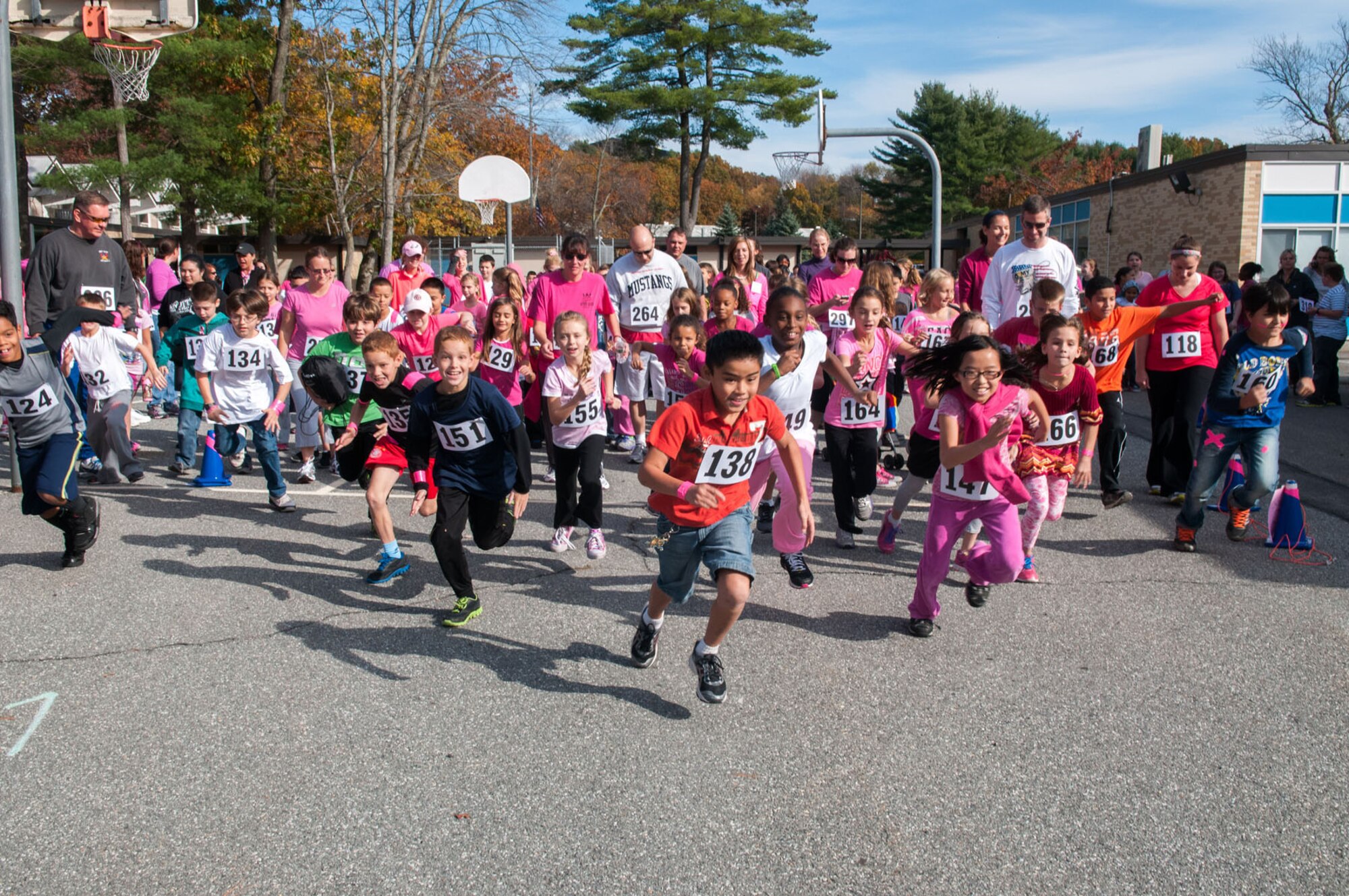 HANSCOM AIR FORCE BASE, Mass. – Hanscom Middle School students, teachers and parents, all sporting a pink item, take off for the school’s Run for Breast Cancer event Oct. 23. The race was held as part of Breast Cancer Awareness Month. (U.S. Air Force photo by Rick Berry)