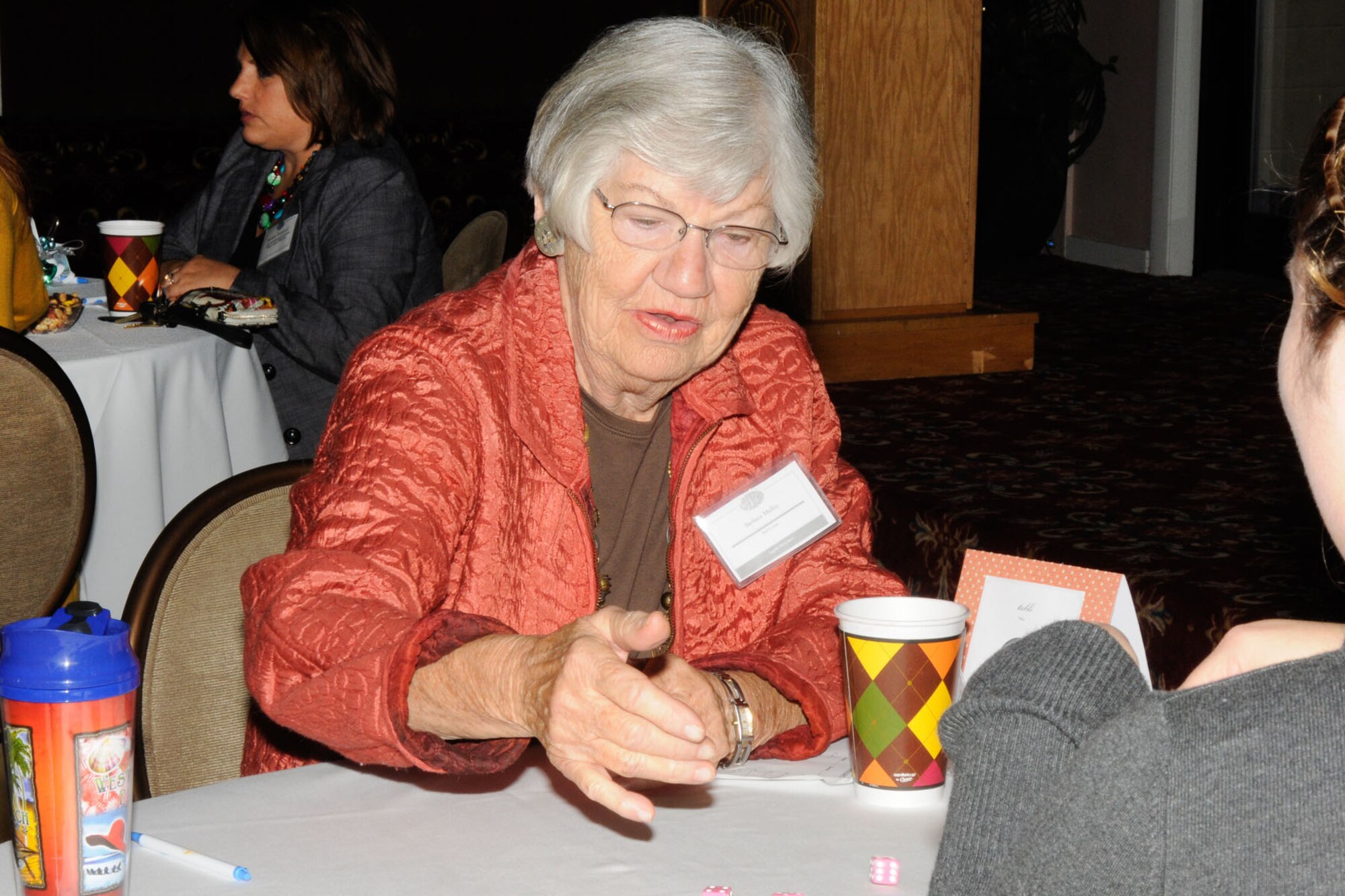 HANSCOM AIR FORCE BASE, Mass. – Barbara Mullin roles the dice during the Hanscom Spouses Club Harvest Bunco event at the Minuteman Commons Oct. 19. The club offers many social and community service activities for military spouses. (U.S. Air Force photo by Linda LaBonte Britt)