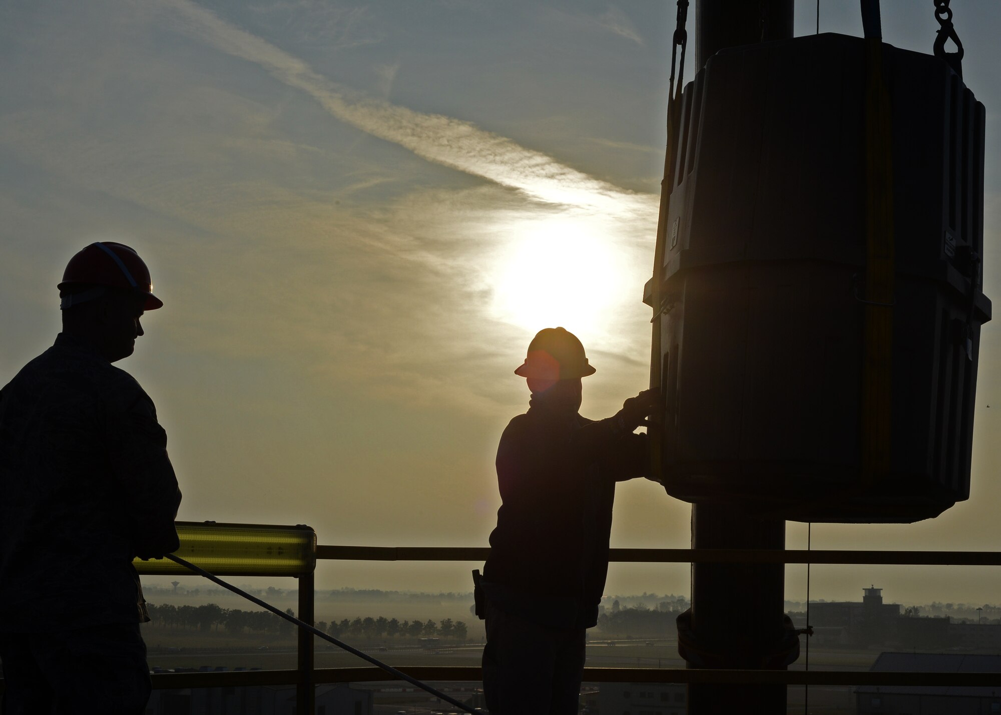 Airmen assigned to the 31st Communications Squadron guide a new weather radar system onto a tower at Aviano Oct. 18, 2012.  The new Portable Doppler Radar systemreplaces the Tactical Weather System, which is no longer supported by the Air Force.(U.S. Air Force photo by Staff Sgt. Ryan Whitney)