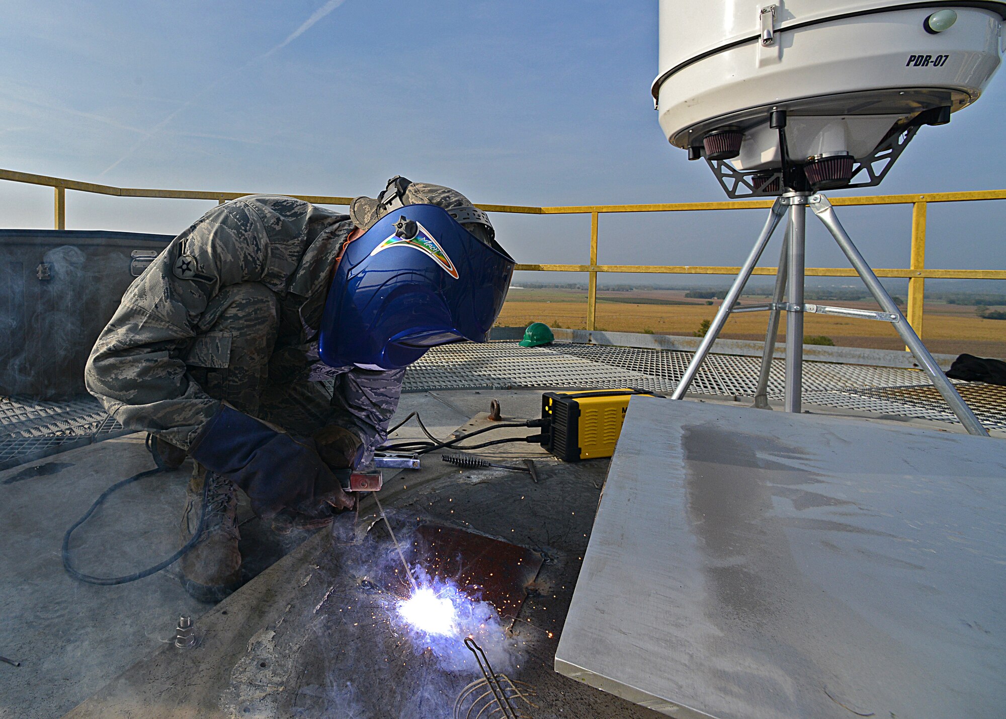Airman Alex Harper, 31st Civil Engineer Squadron structural journeyman, welds a cover on a mounting area for a new weather radar system at Aviano Air Base Oct. 18, 2012.   The new radar requires less maintenance than the previous system, and has networking capability that allow it to communicate with systems in Germany. (U.S. Air Force photo by Staff Sgt. Ryan Whitney)