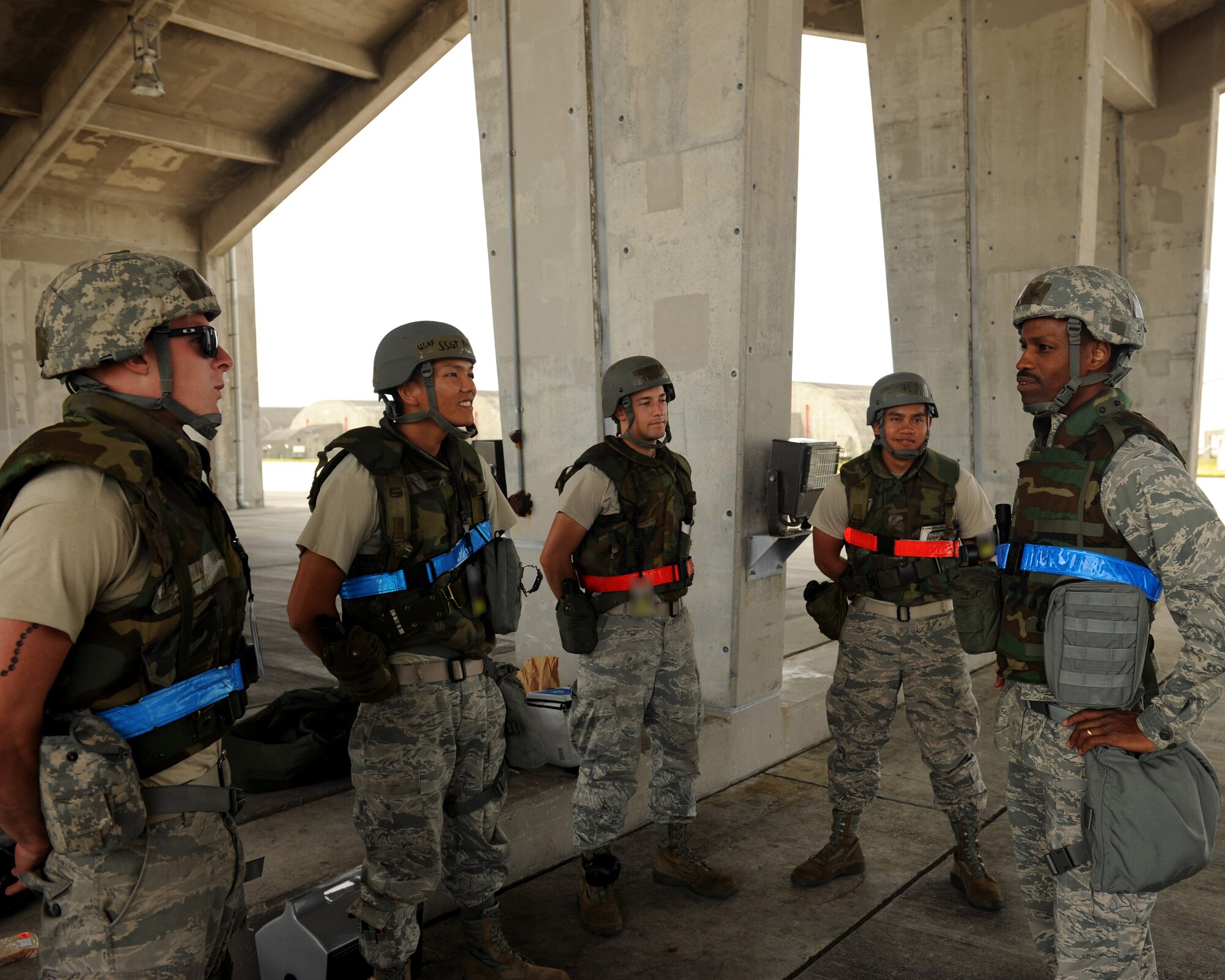 U.S. Air Force Chaplain (Capt.) Kennie Neal, an 18th Wing chaplain, speaks with Airmen of the 44th and 67th Aircraft Maintenance Units for a morale-boosting visitation during Exercise Beverly Bearcat 12-1, an operational readiness inspection on Kadena Air Base, Japan, Oct. 24, 2012. Neal makes daily visits to units like the 18th Aircraft Maintenance Squadron and the 18th Munitions Squadron. (U.S. Air Force photo/Airman 1st Class Hailey R. Davis) 