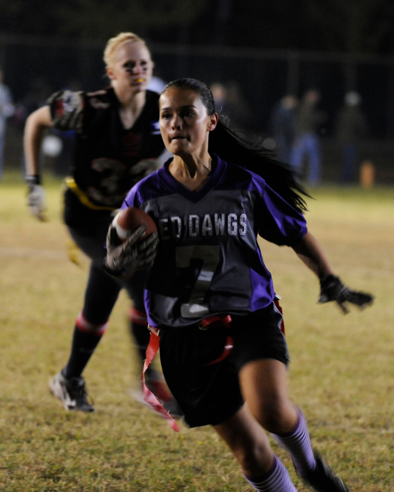 Joanne Schlieth, 8th Medical Operations Squadron, Lady Med Dawgs halfback  runs into the end zone during the powder puff championship against the 8th Security Forces Lethal Ladies at Kunsan Air Base, Republic of Korea, Oct. 20, 2012. Her touchdown led to the Med Dawgs taking first place trophy. (U.S. Air Force photo/Senior Airman Marcus Morris)
